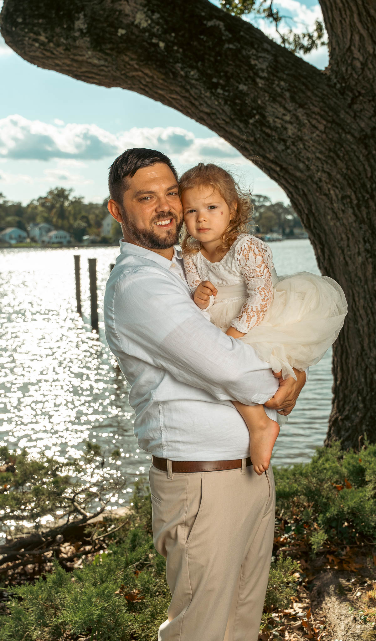 Family portrait by the water before the ceremony — backyard wedding in Annapolis, Maryland