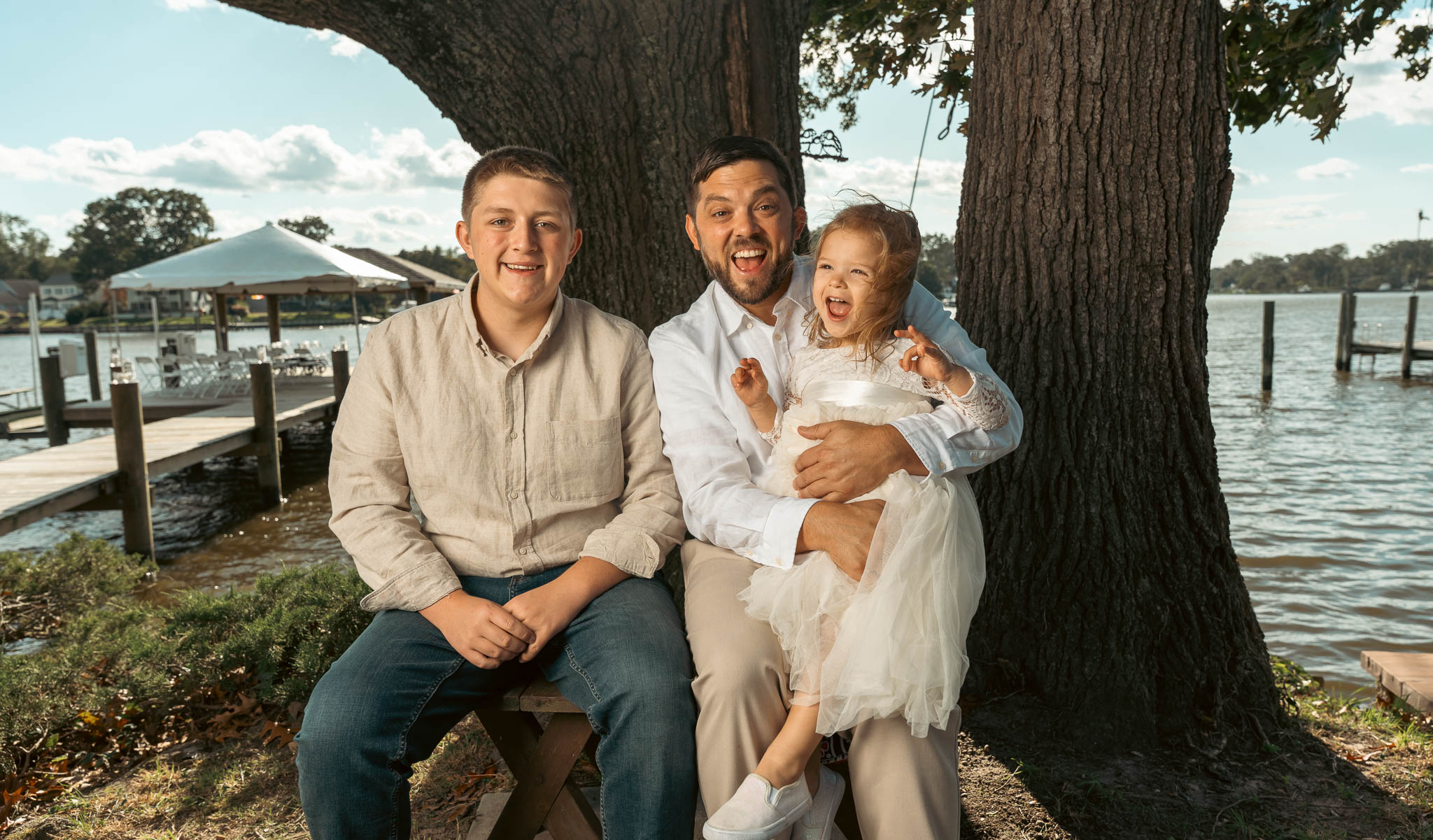 Family portraits under the oak at the water's edge — backyard wedding in Annapolis, Maryland