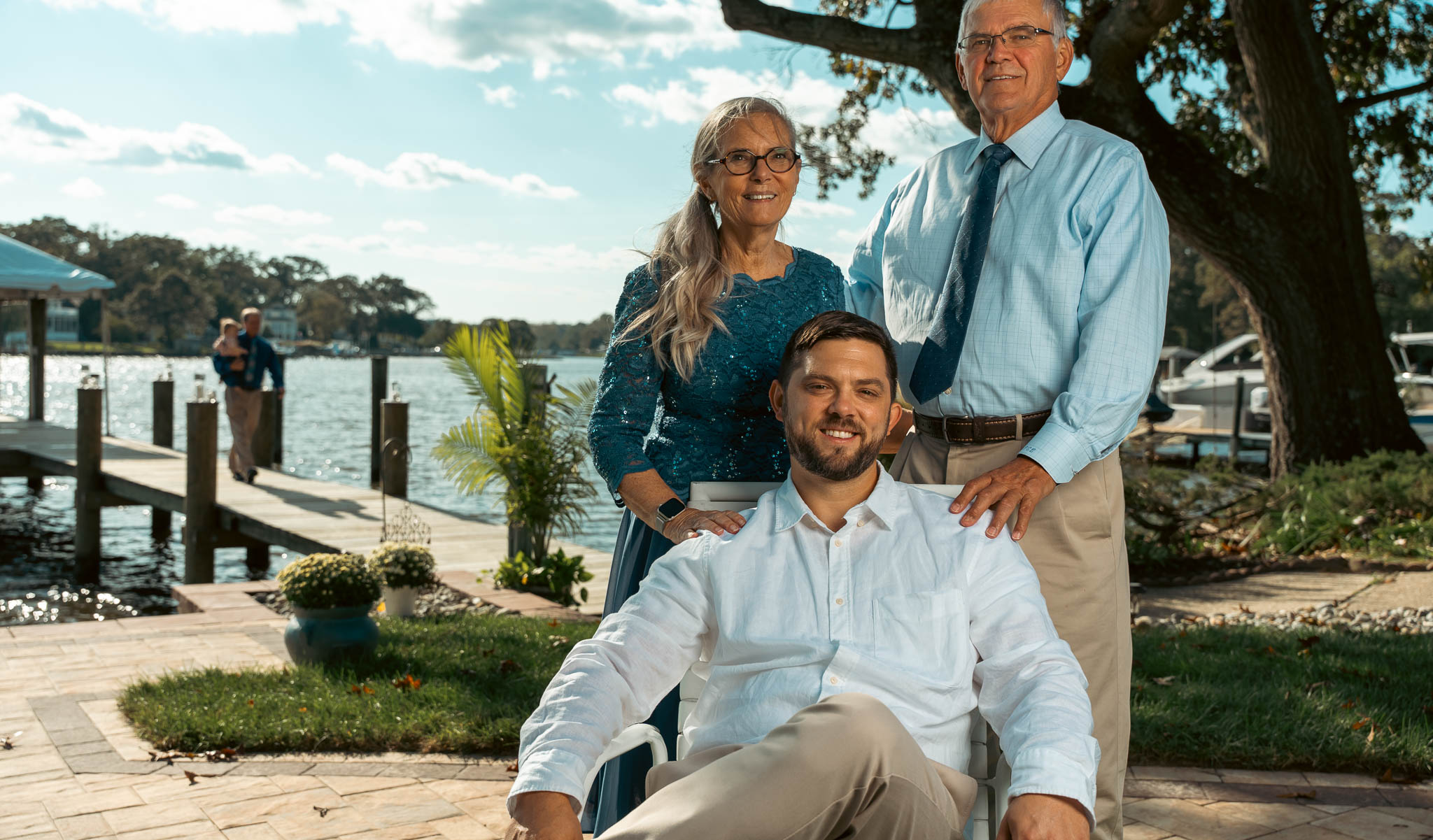 Relatives photographed by the creek before the wedding — backyard wedding in Annapolis, Maryland