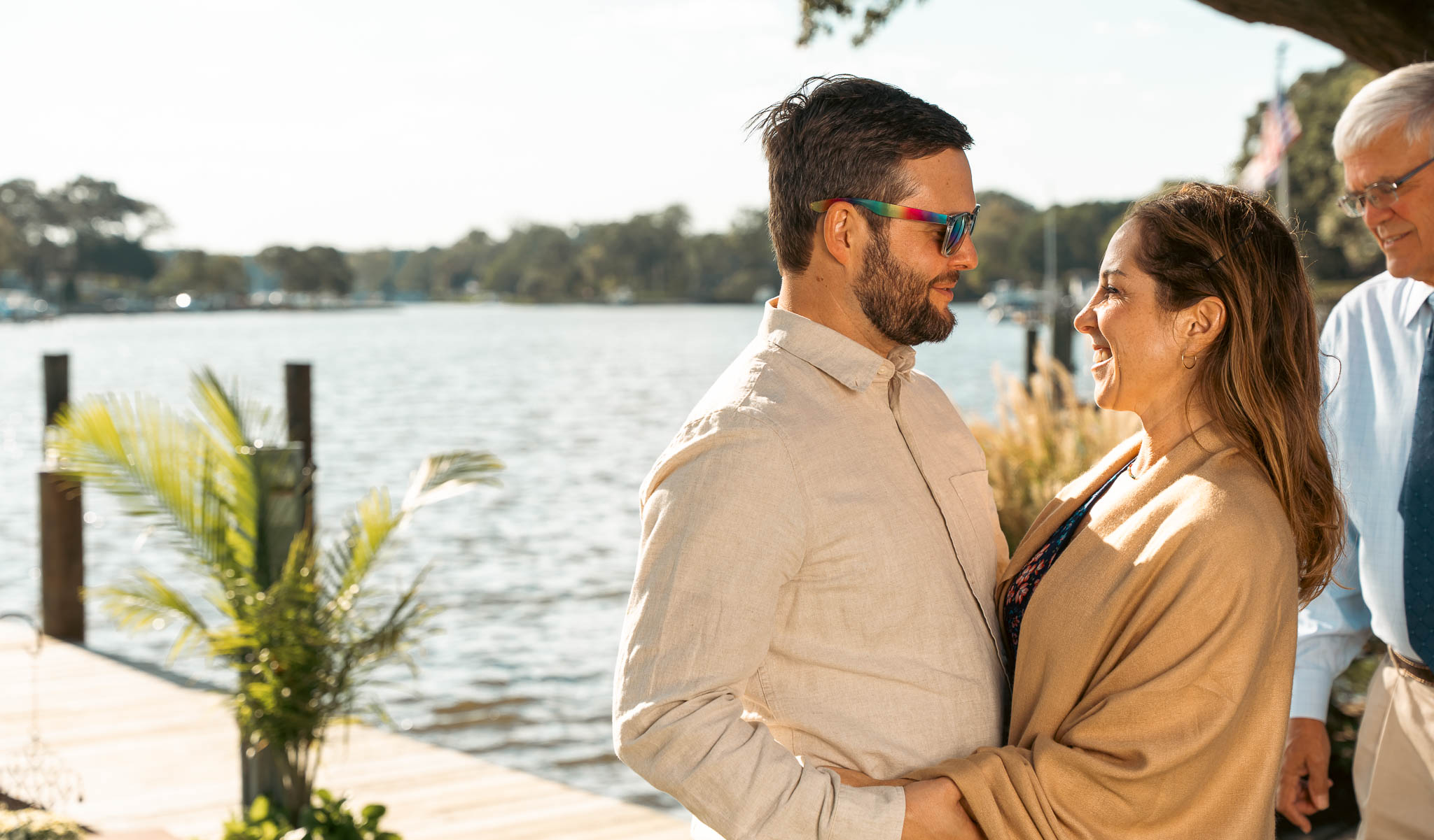 Relatives photographed by the creek before the wedding — backyard wedding in Annapolis, Maryland