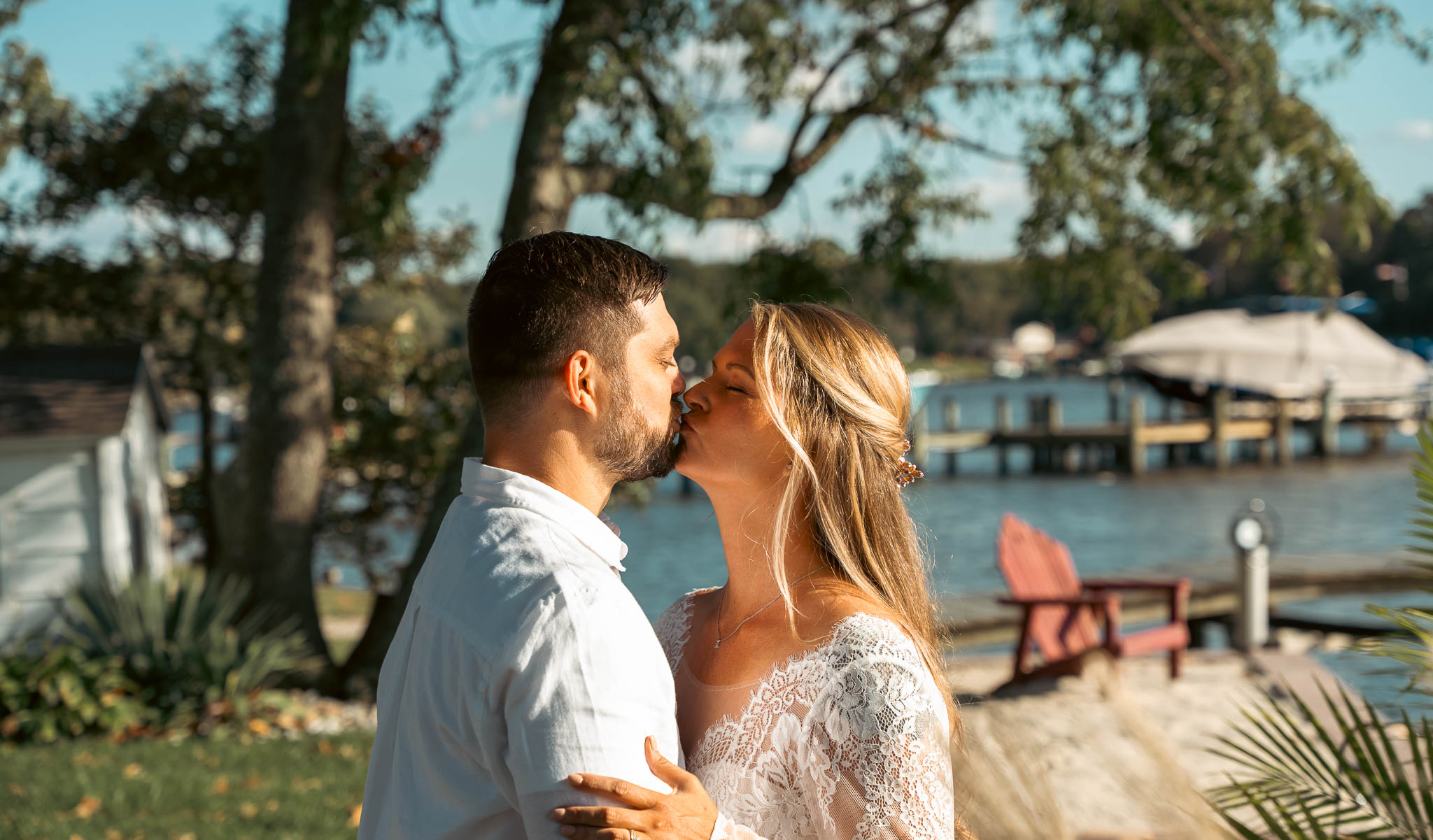 First look on the lawn above the creek — backyard wedding in Annapolis, Maryland