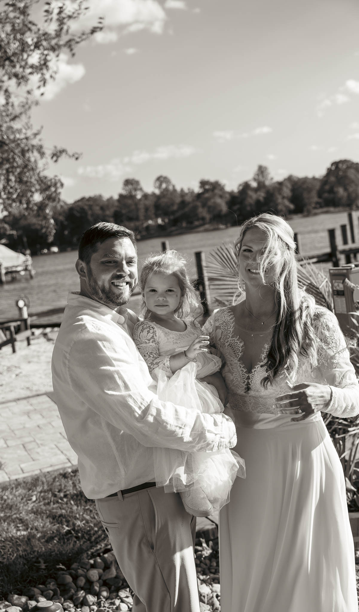 First look on the lawn above the creek — backyard wedding in Annapolis, Maryland