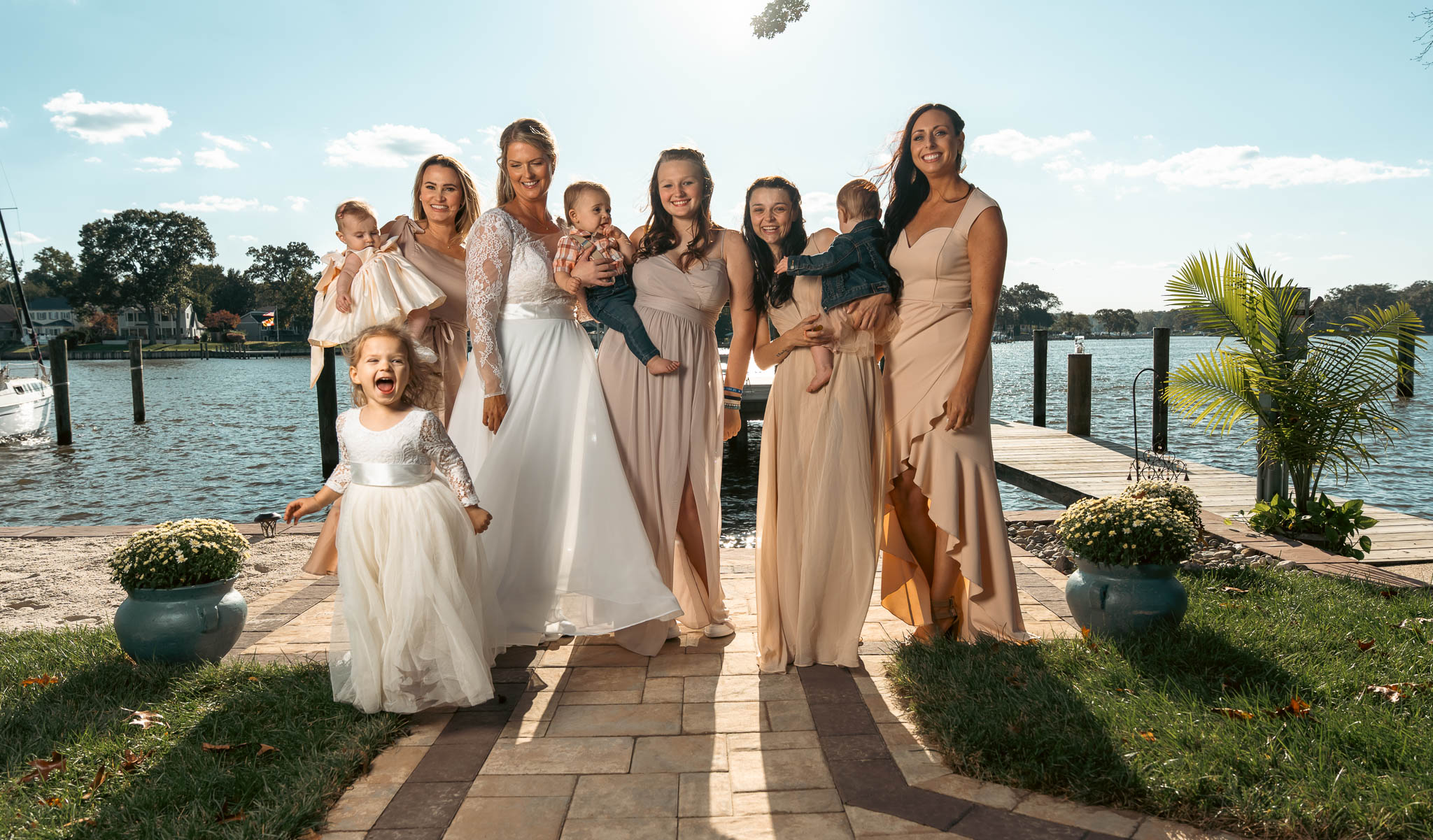 The wedding party photographed by the creek — backyard wedding in Annapolis, Maryland