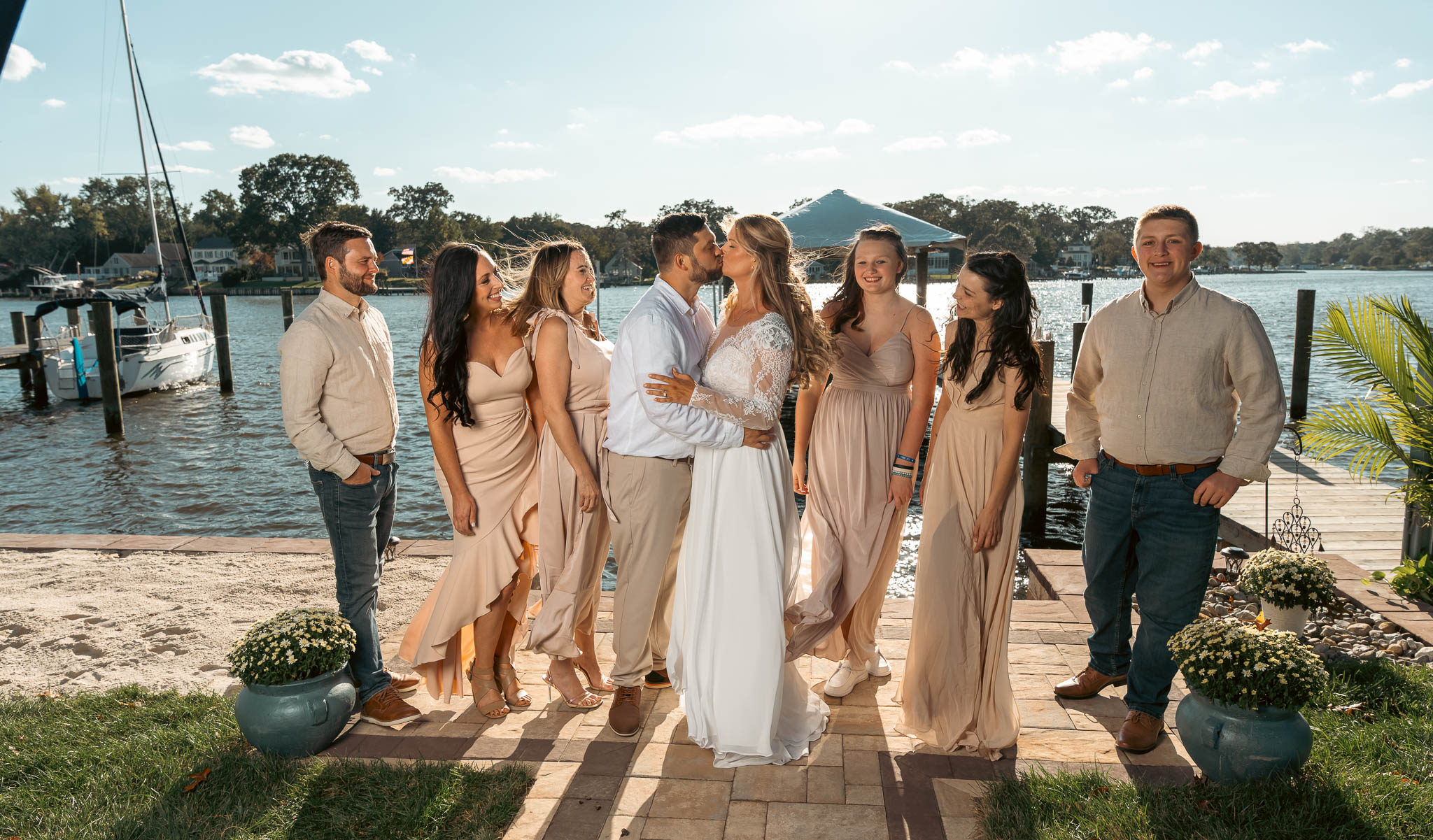 The wedding party photographed by the creek — backyard wedding in Annapolis, Maryland