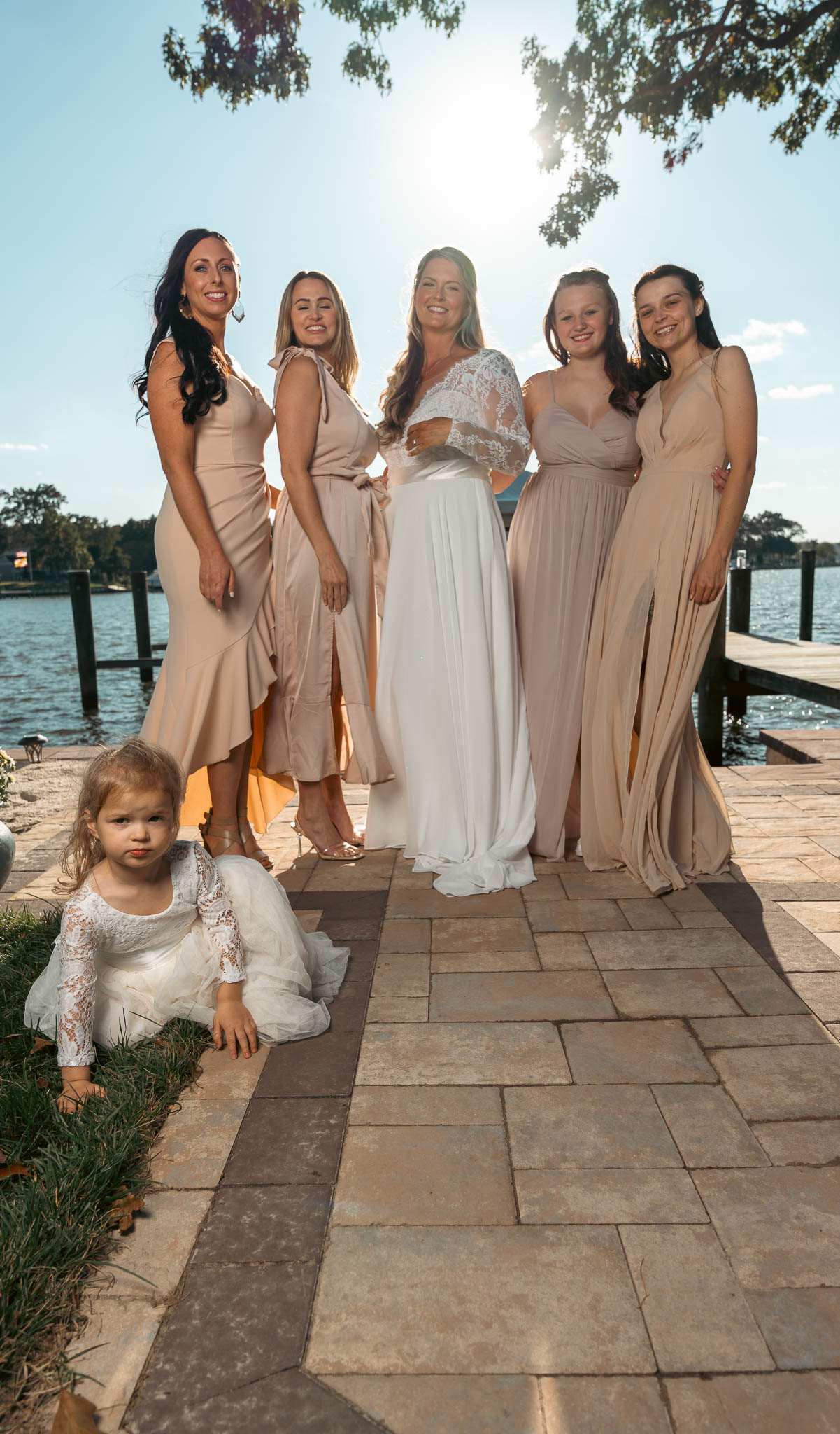 The wedding party photographed by the creek — backyard wedding in Annapolis, Maryland