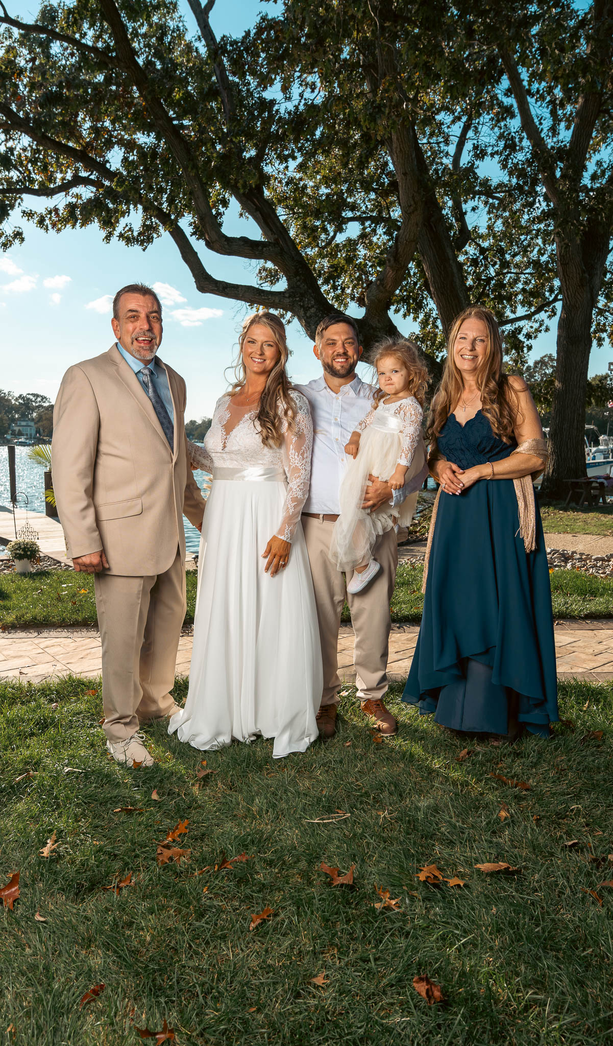 Group portrait with the creek behind — backyard wedding in Annapolis, Maryland