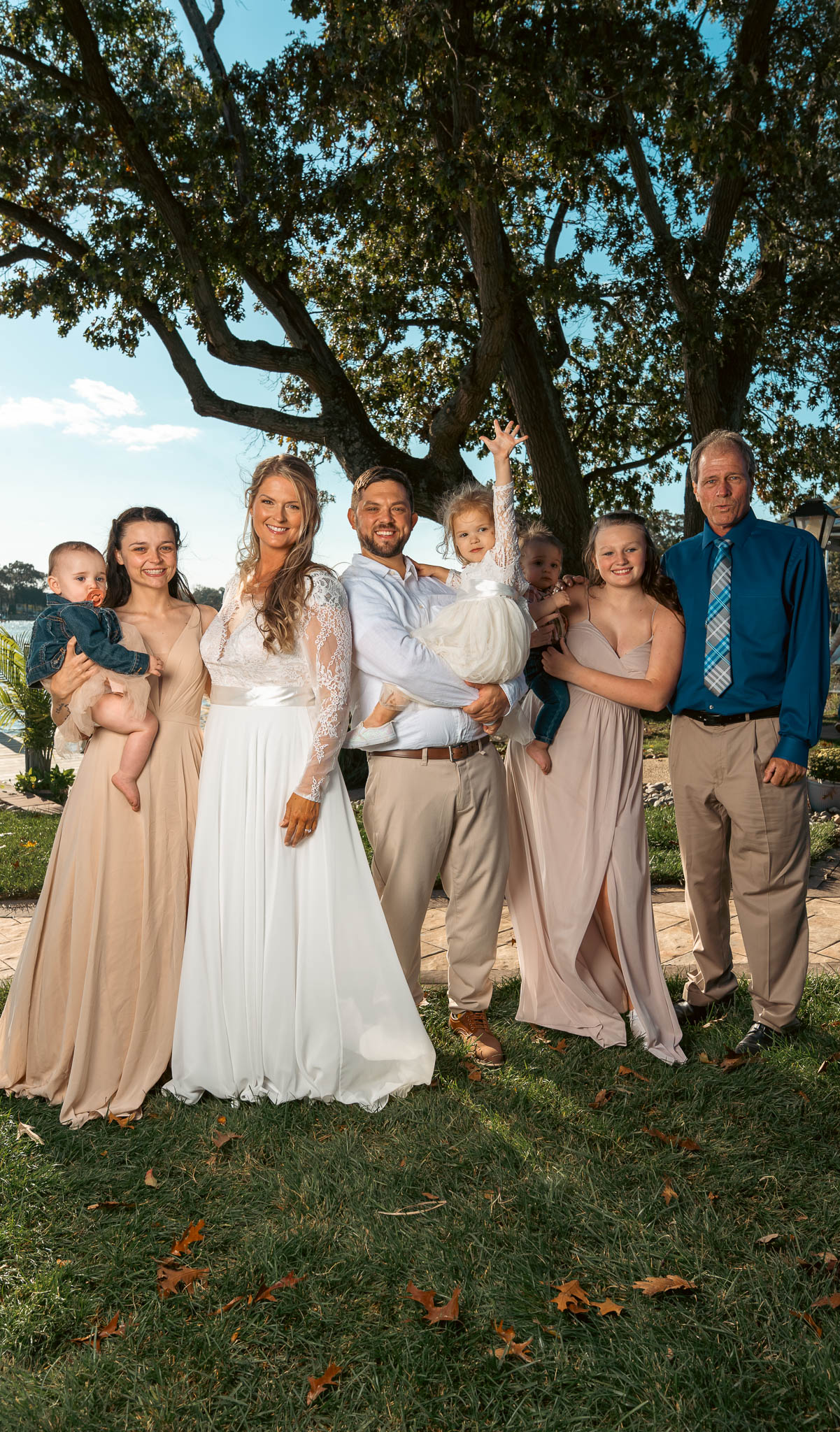 Family photographed together before the ceremony — backyard wedding in Annapolis, Maryland