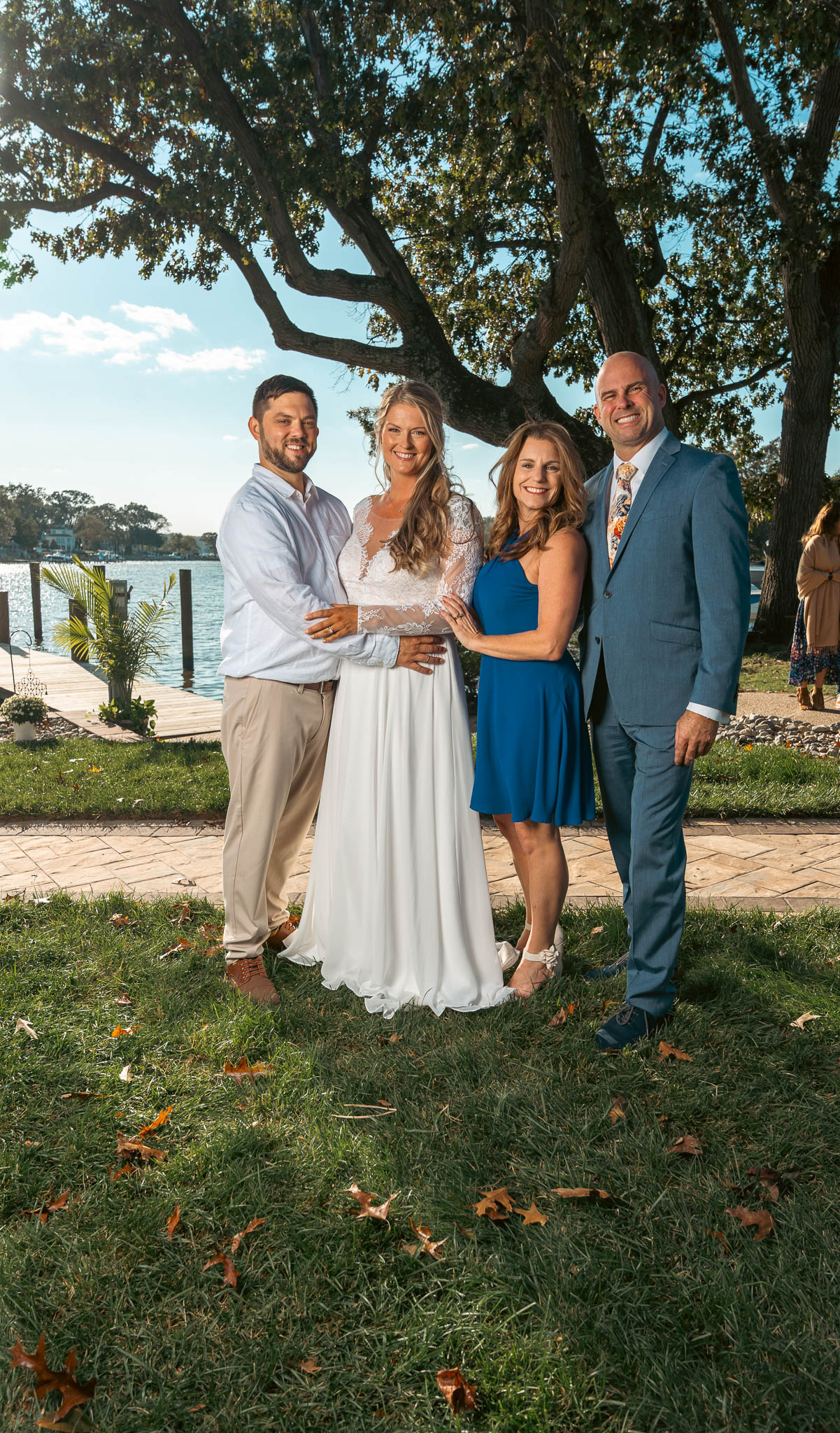 Group portrait with the creek behind — backyard wedding in Annapolis, Maryland
