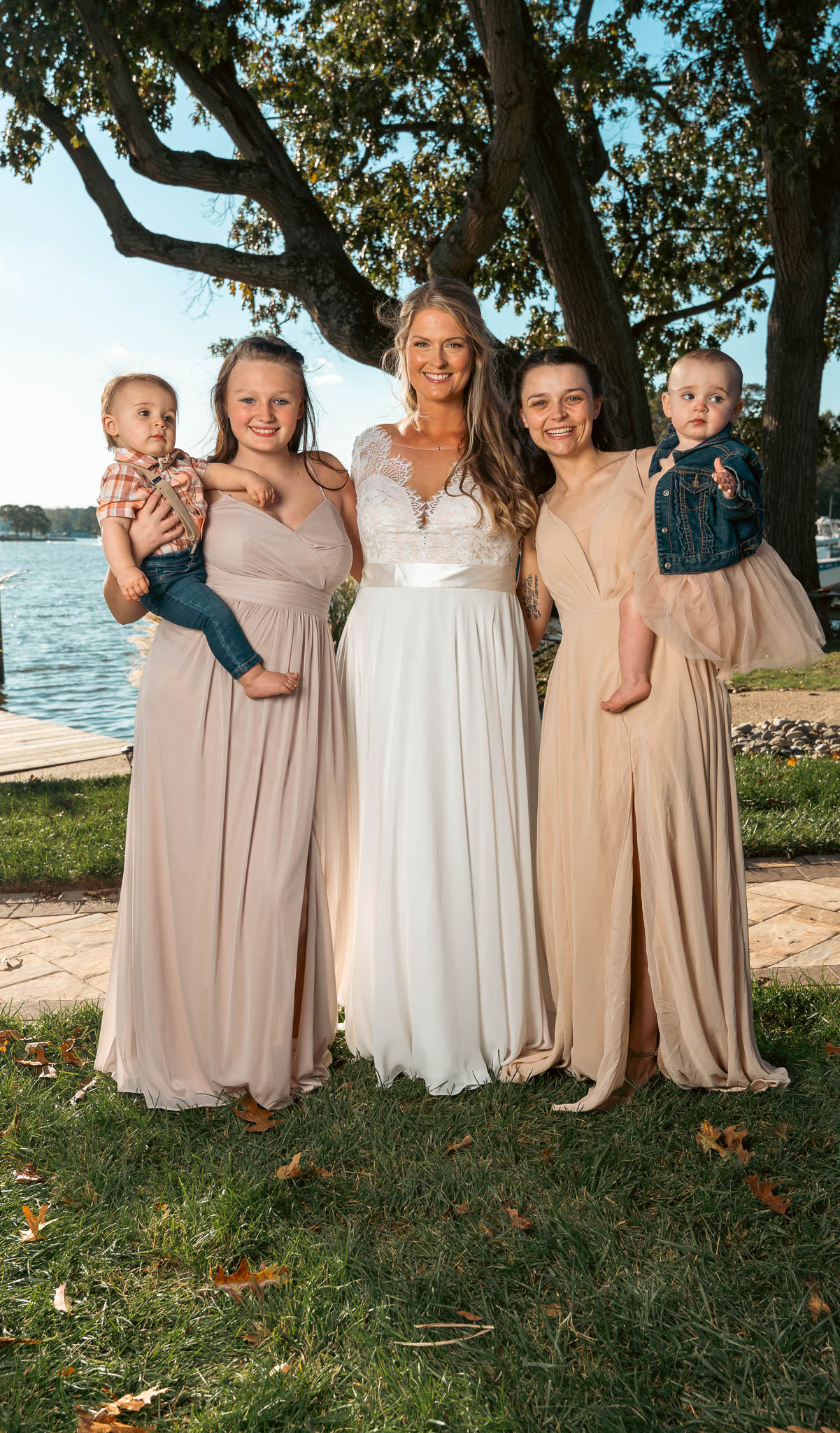 Group portrait with the creek behind — backyard wedding in Annapolis, Maryland