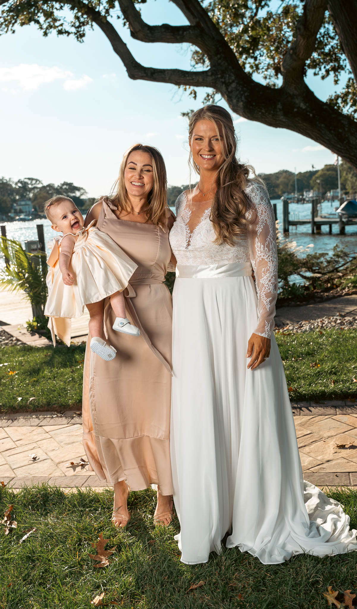 Relatives posed at the water's edge — backyard wedding in Annapolis, Maryland