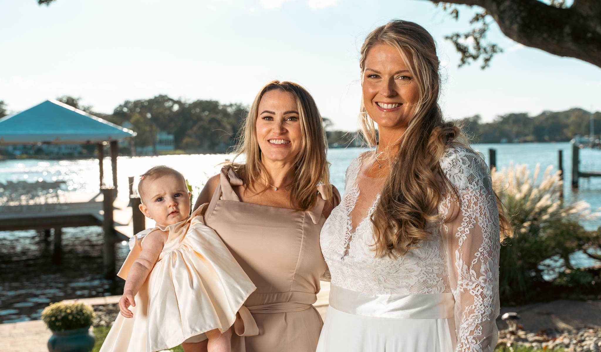 Family group beneath the oak on the lawn — backyard wedding in Annapolis, Maryland