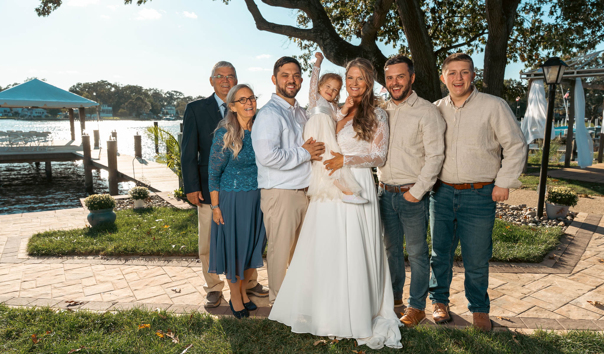 Group portrait with the creek behind — backyard wedding in Annapolis, Maryland