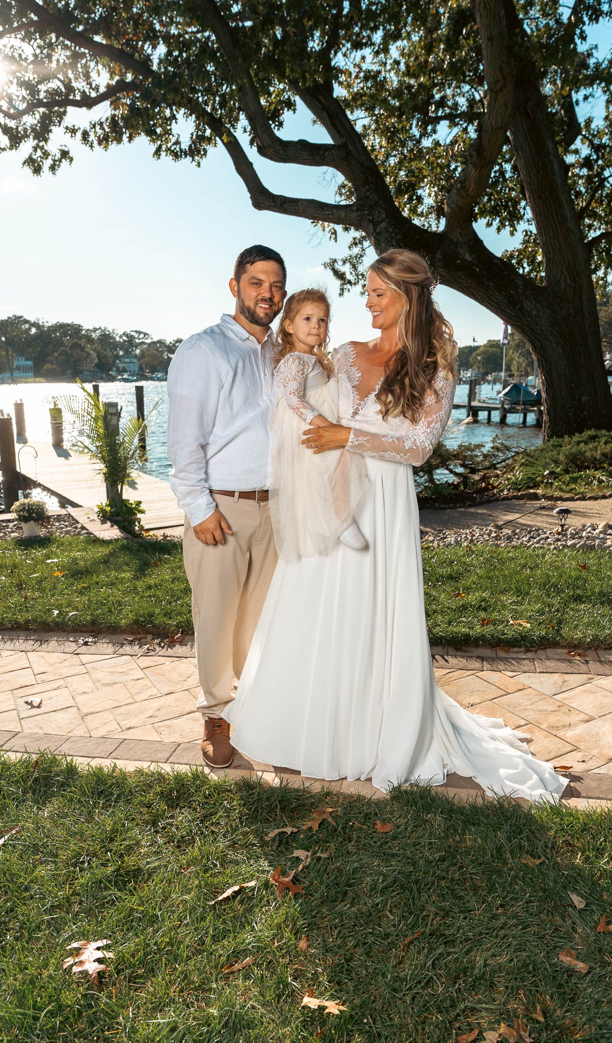Relatives posed at the water's edge — backyard wedding in Annapolis, Maryland
