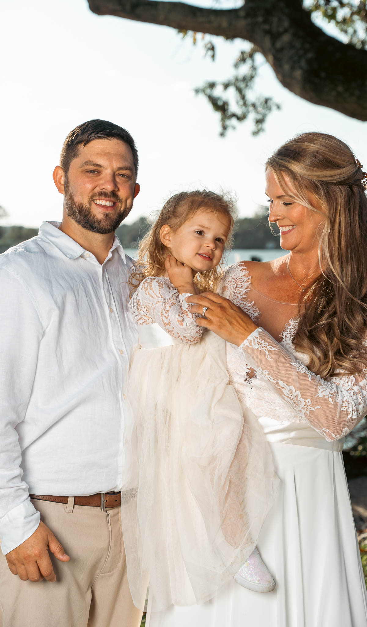 Family group beneath the oak on the lawn — backyard wedding in Annapolis, Maryland