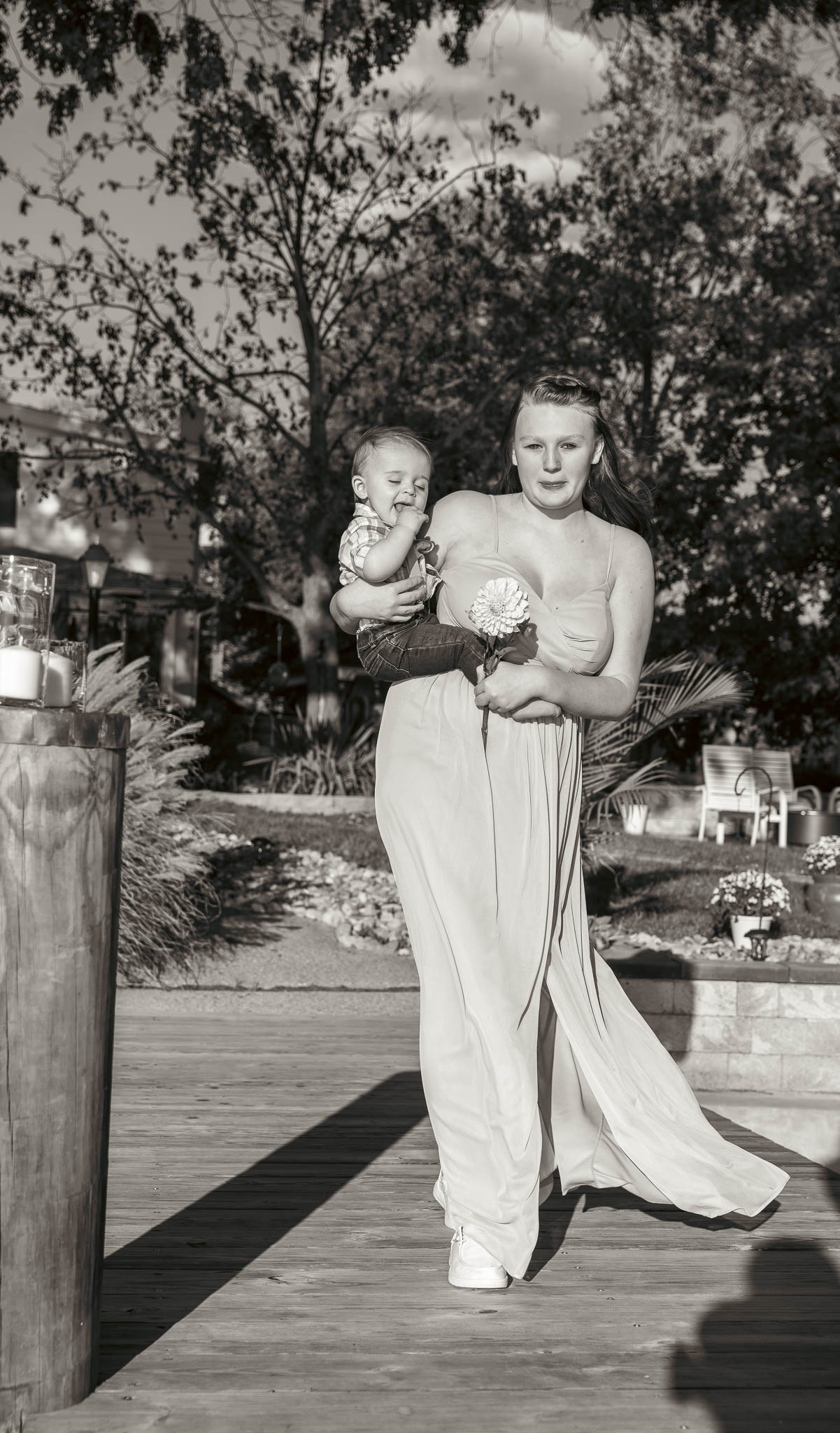 Family making their way to the ceremony on the dock — backyard wedding in Annapolis, Maryland