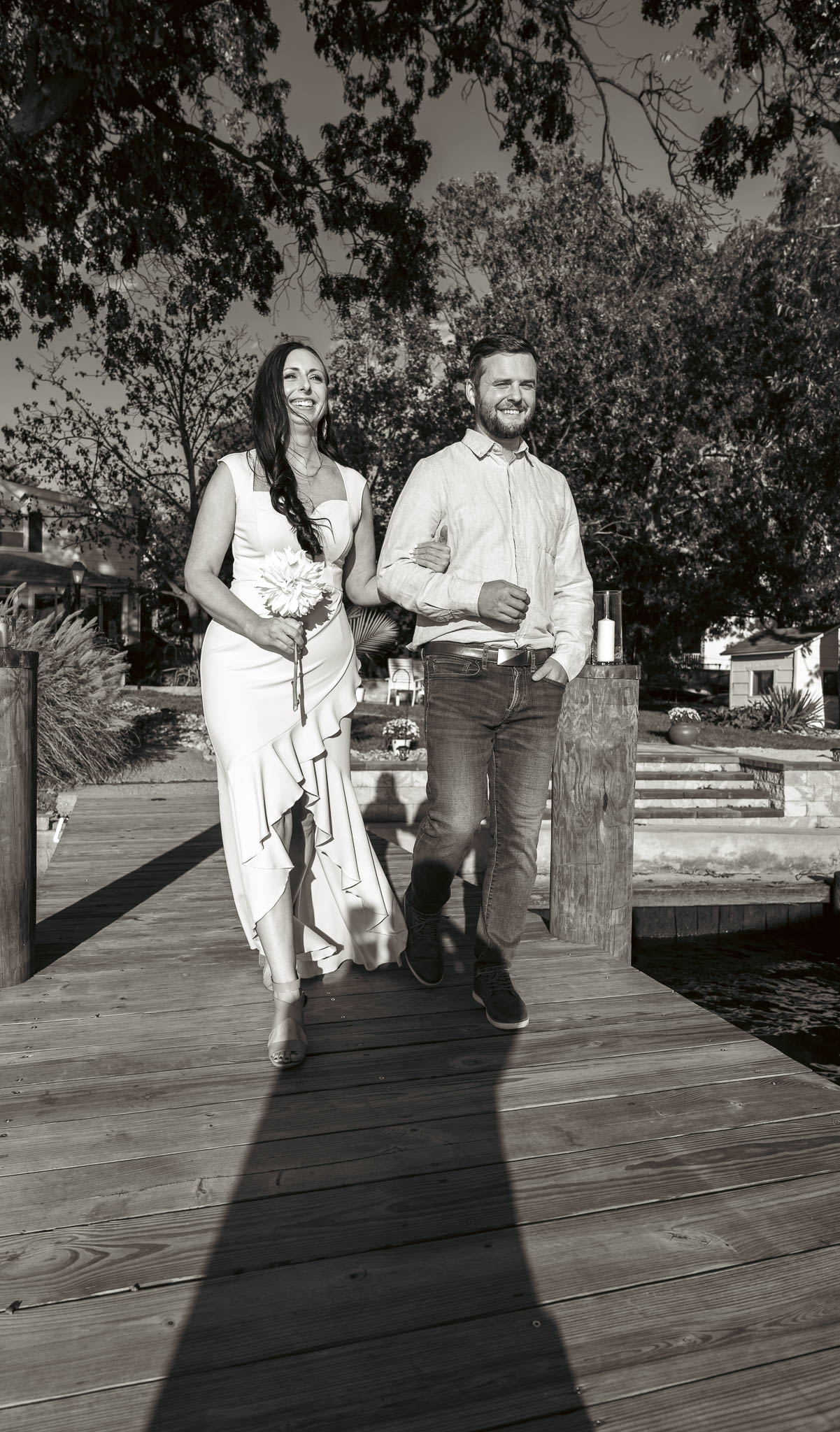 Family making their way to the ceremony on the dock — backyard wedding in Annapolis, Maryland