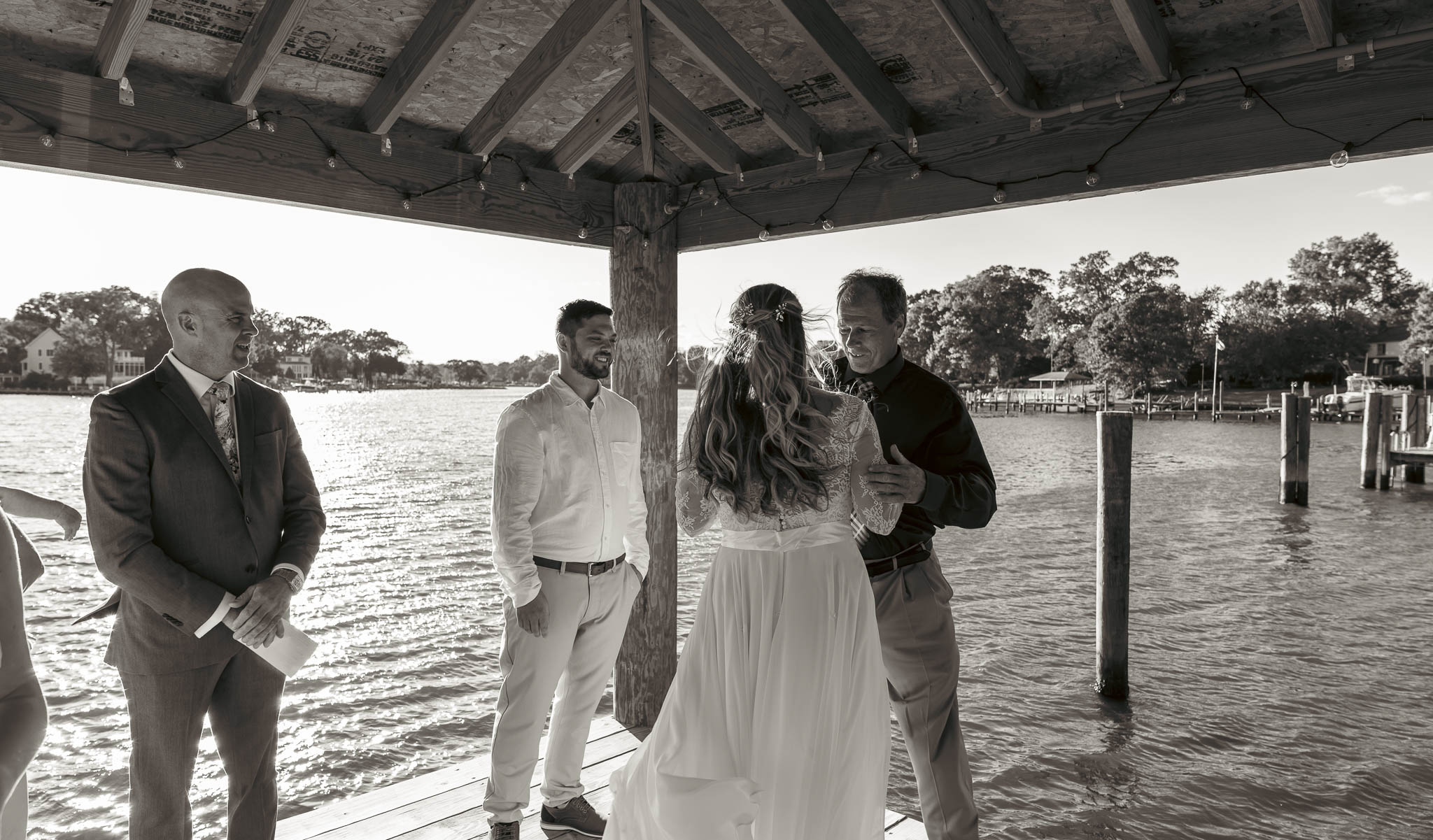 The bride's entrance along the waterfront — backyard wedding in Annapolis, Maryland