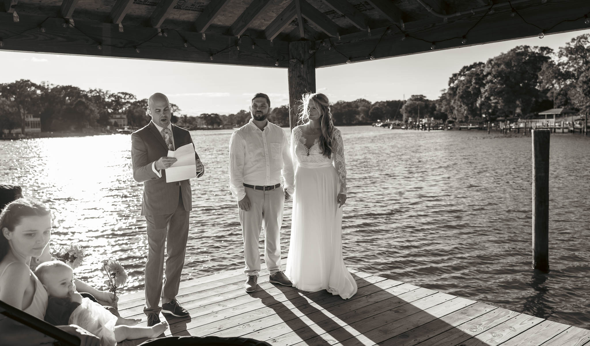 Walking to the ceremony at the end of the dock — backyard wedding in Annapolis, Maryland