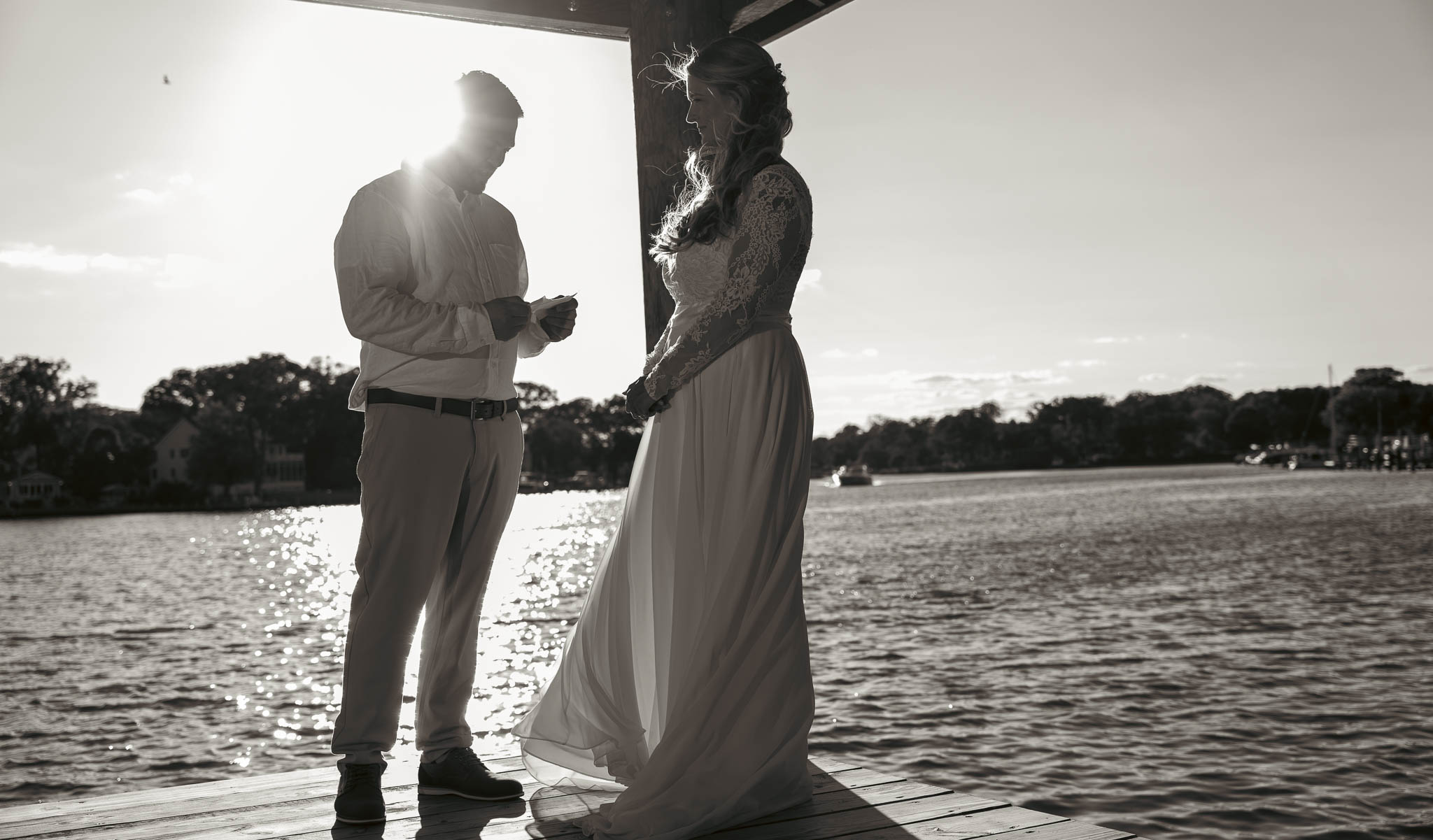 Wedding ceremony under the pavilion at the end of the dock — backyard wedding in Annapolis, Maryland