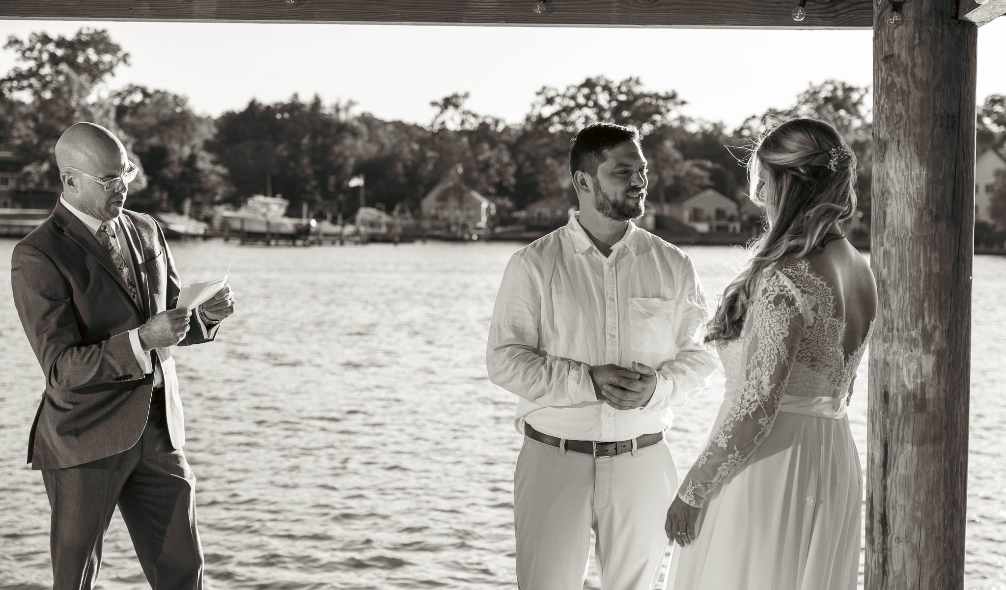 Wedding ceremony under the pavilion at the end of the dock — backyard wedding in Annapolis, Maryland