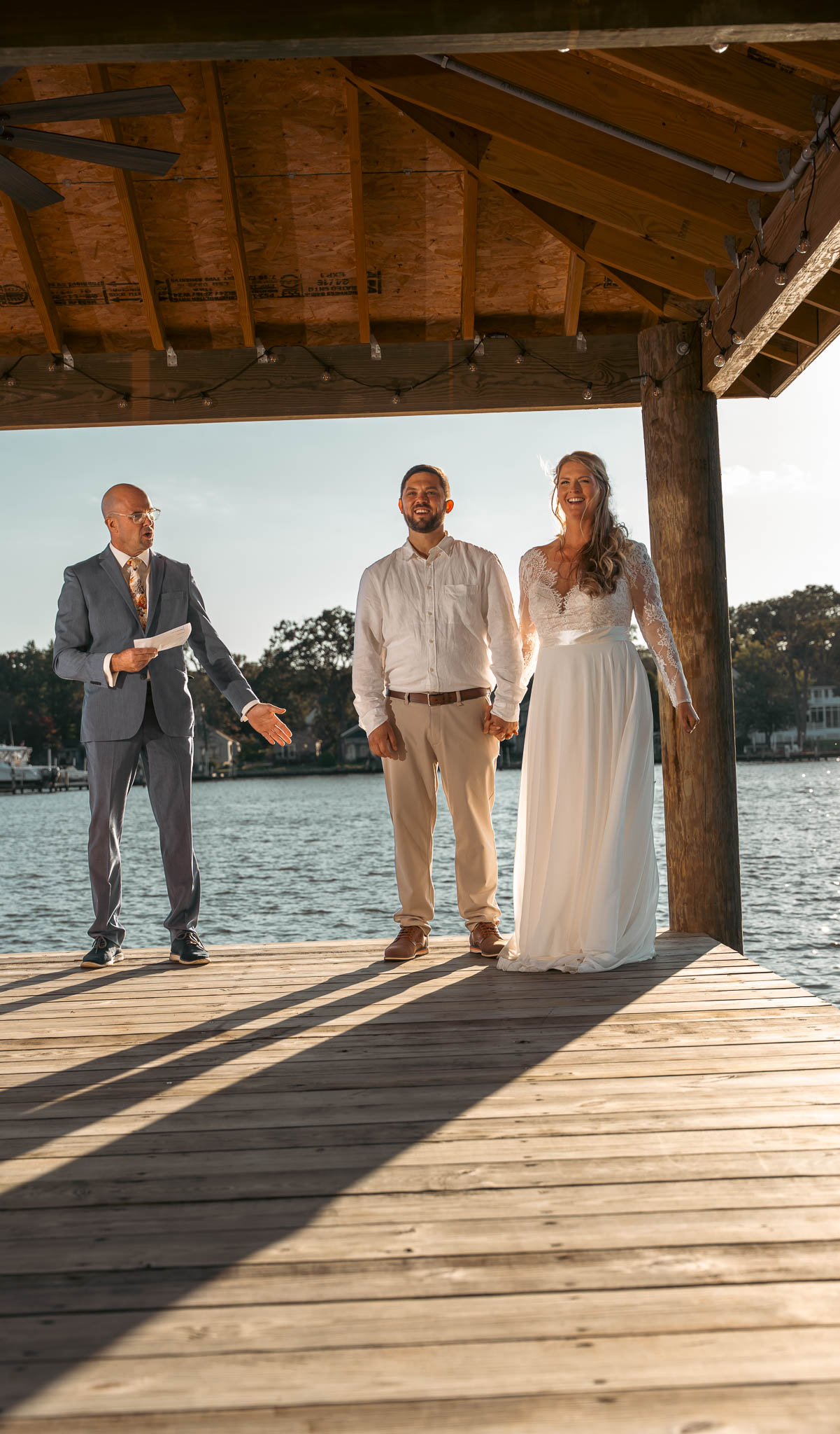 Bride and groom just after the ceremony on the dock — backyard wedding in Annapolis, Maryland