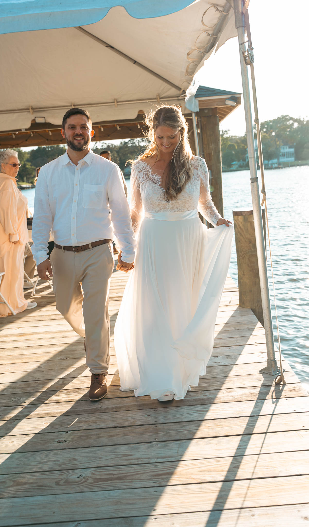 First moments as a married couple over the water — backyard wedding in Annapolis, Maryland