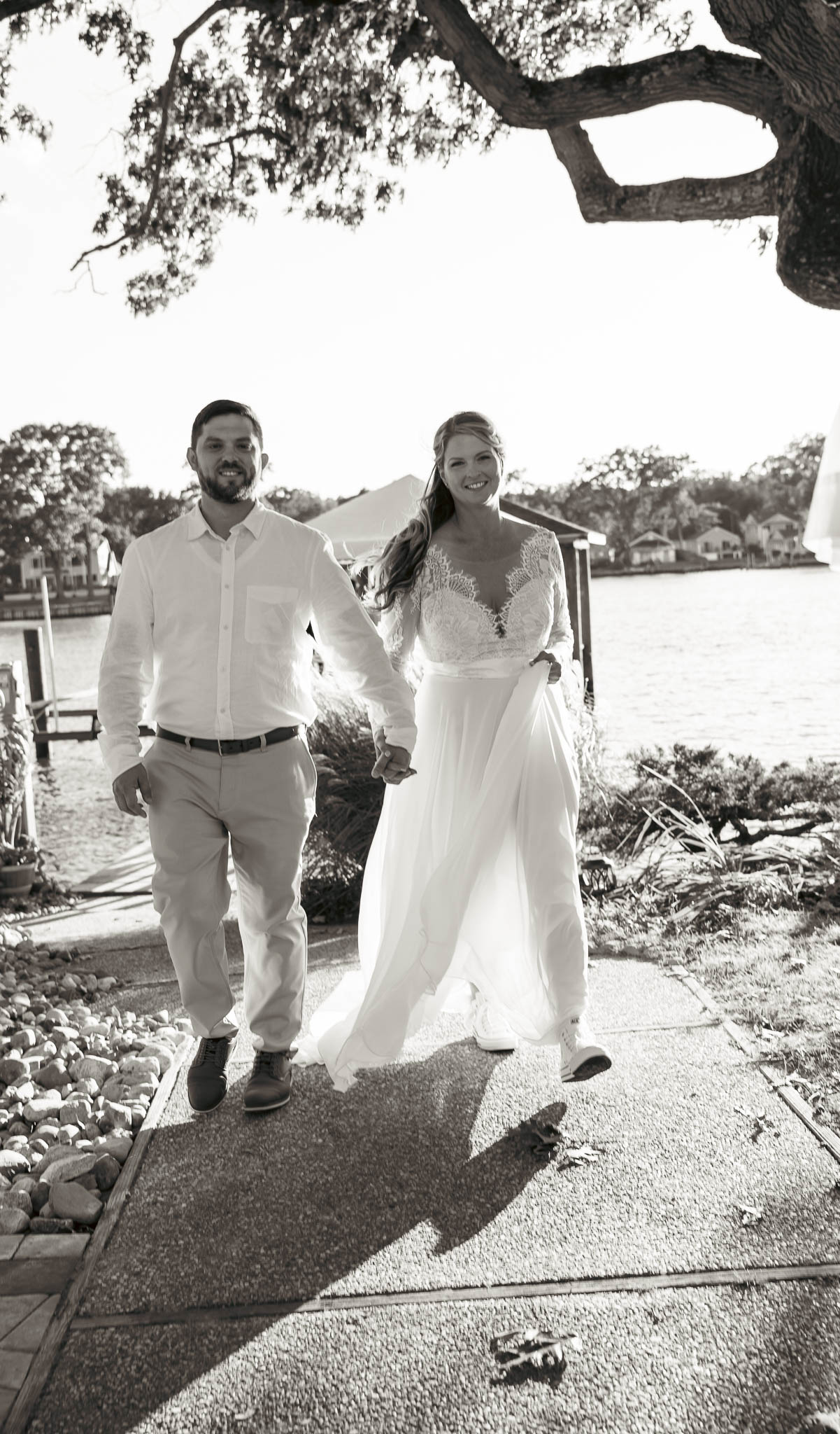 Bride and groom just after the ceremony on the dock — backyard wedding in Annapolis, Maryland