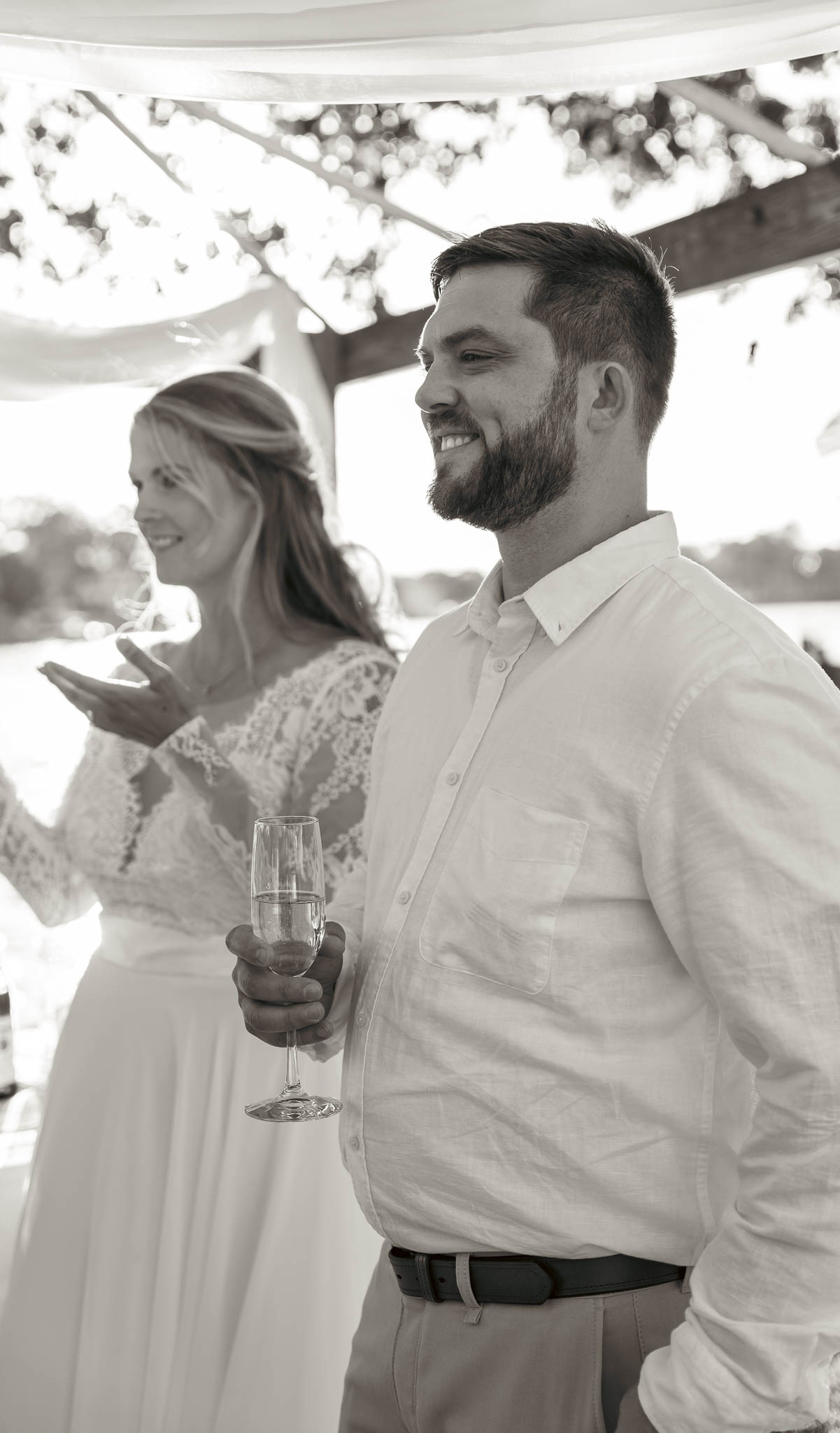 The party spreading out across the yard after the ceremony — backyard wedding in Annapolis, Maryland