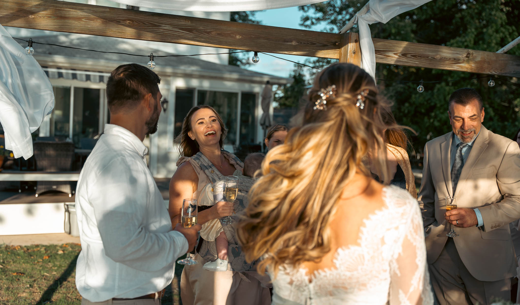 Guests congratulating the couple after the ceremony — backyard wedding in Annapolis, Maryland