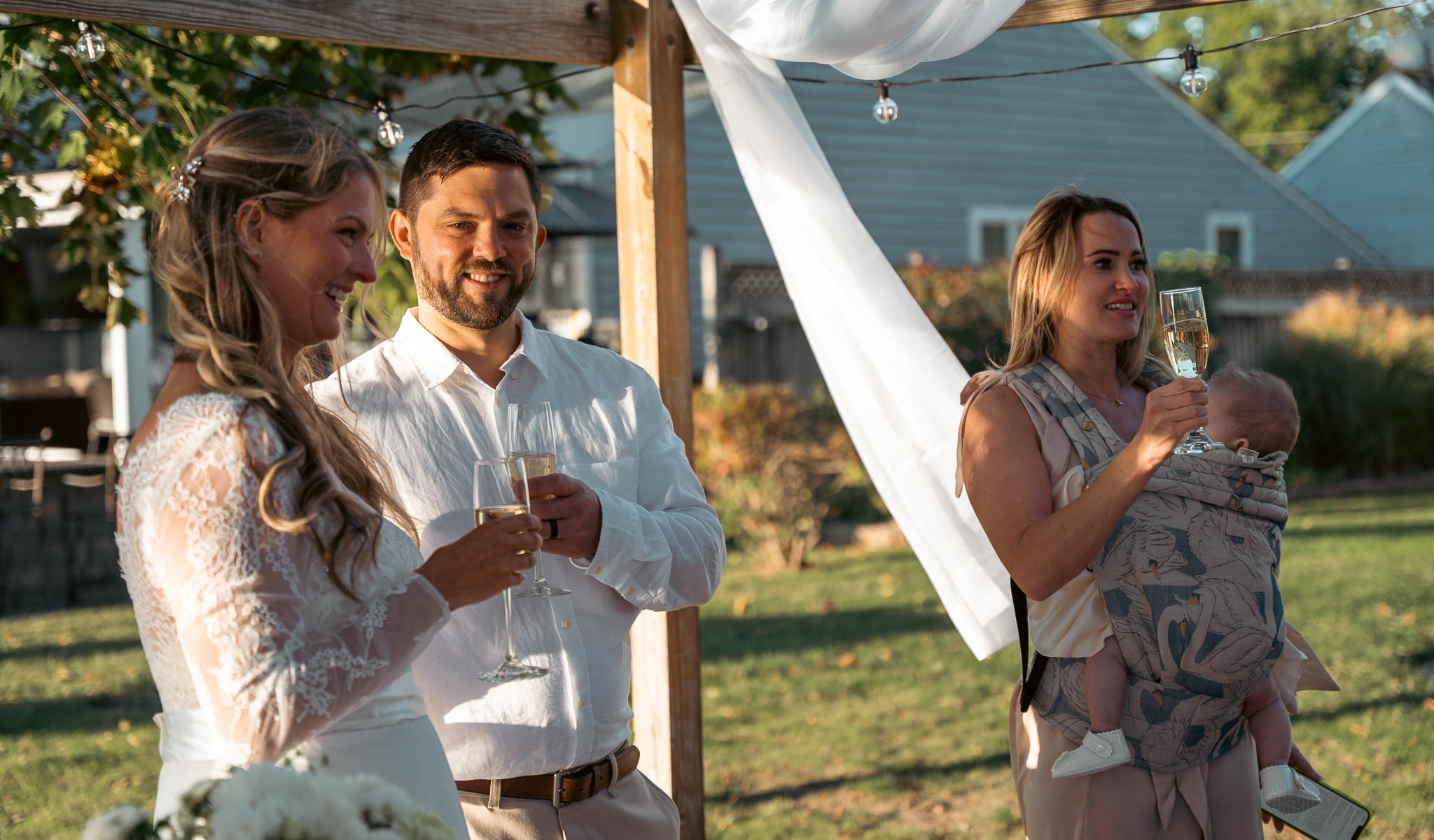 Toasting the newlyweds in the backyard — backyard wedding in Annapolis, Maryland