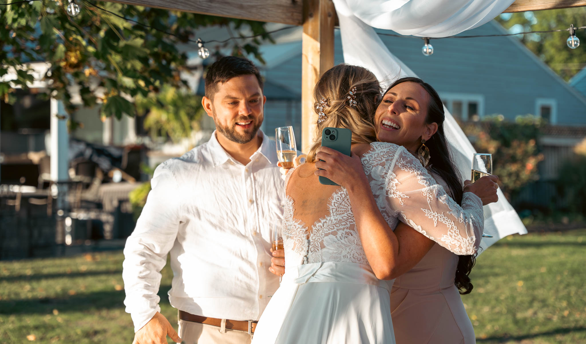 Toasting the newlyweds in the backyard — backyard wedding in Annapolis, Maryland