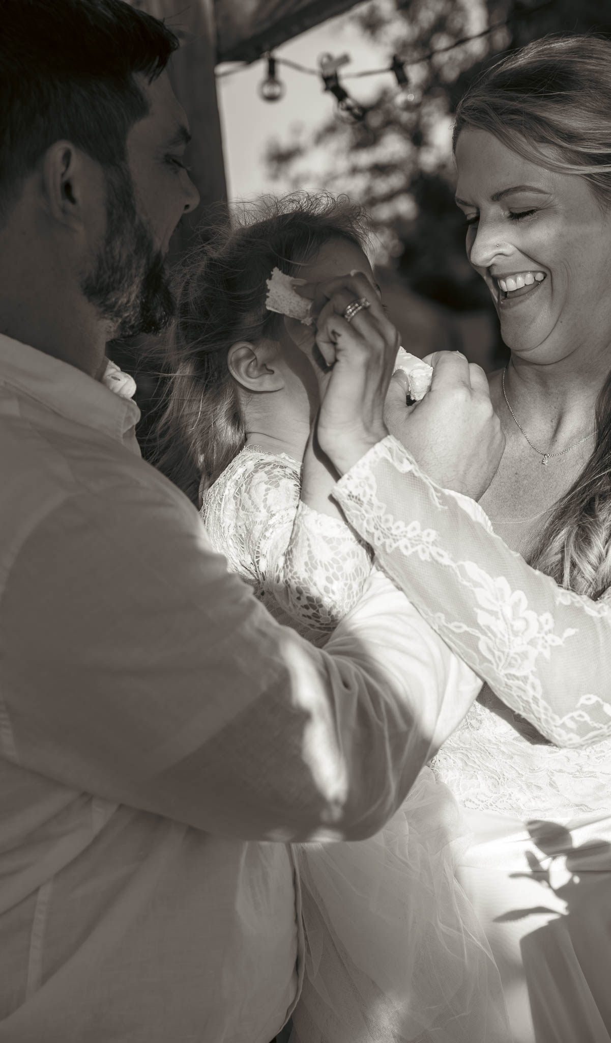 Cake cutting in the backyard at golden hour — backyard wedding in Annapolis, Maryland