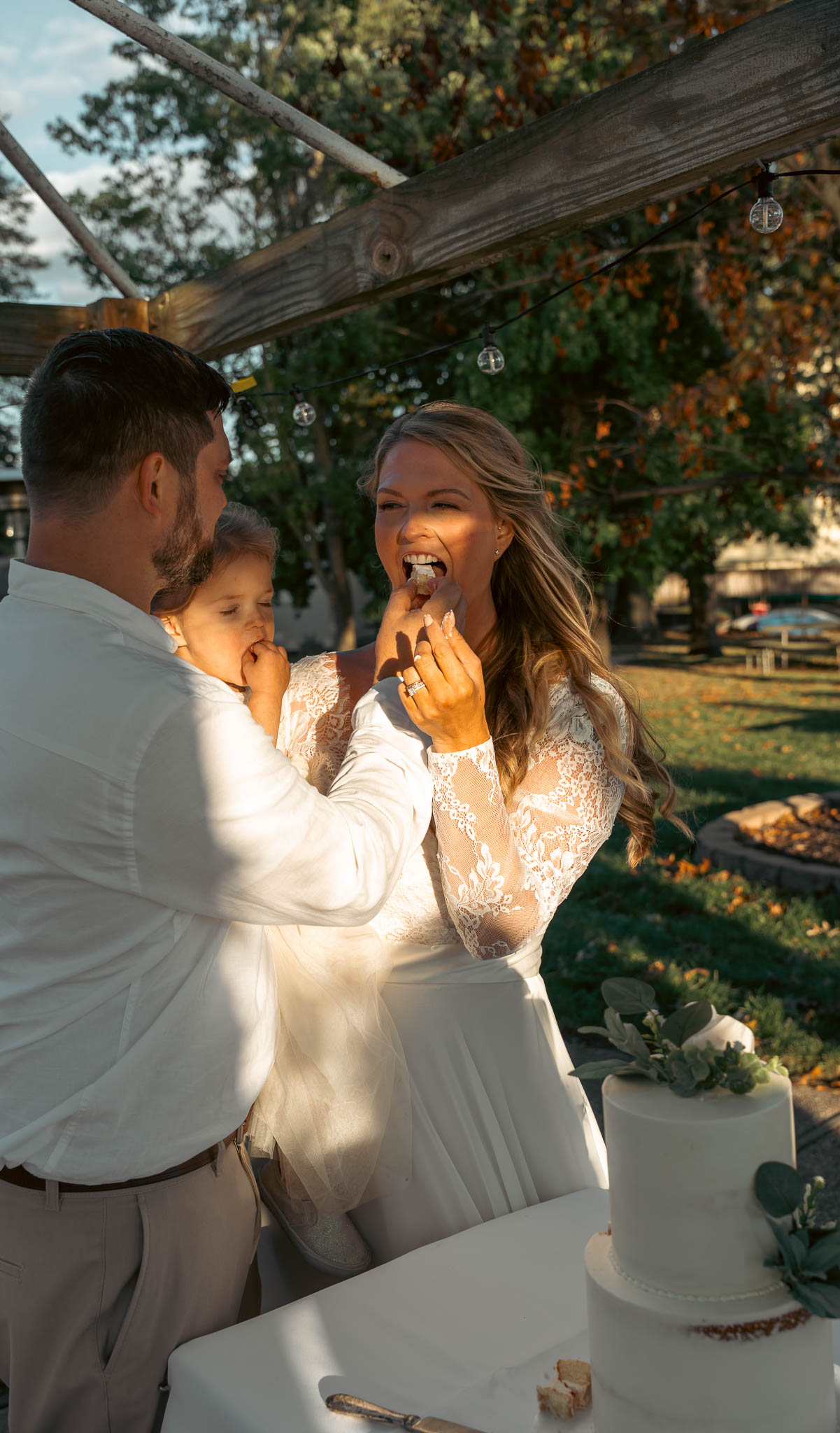 Cake cutting in the backyard at golden hour — backyard wedding in Annapolis, Maryland