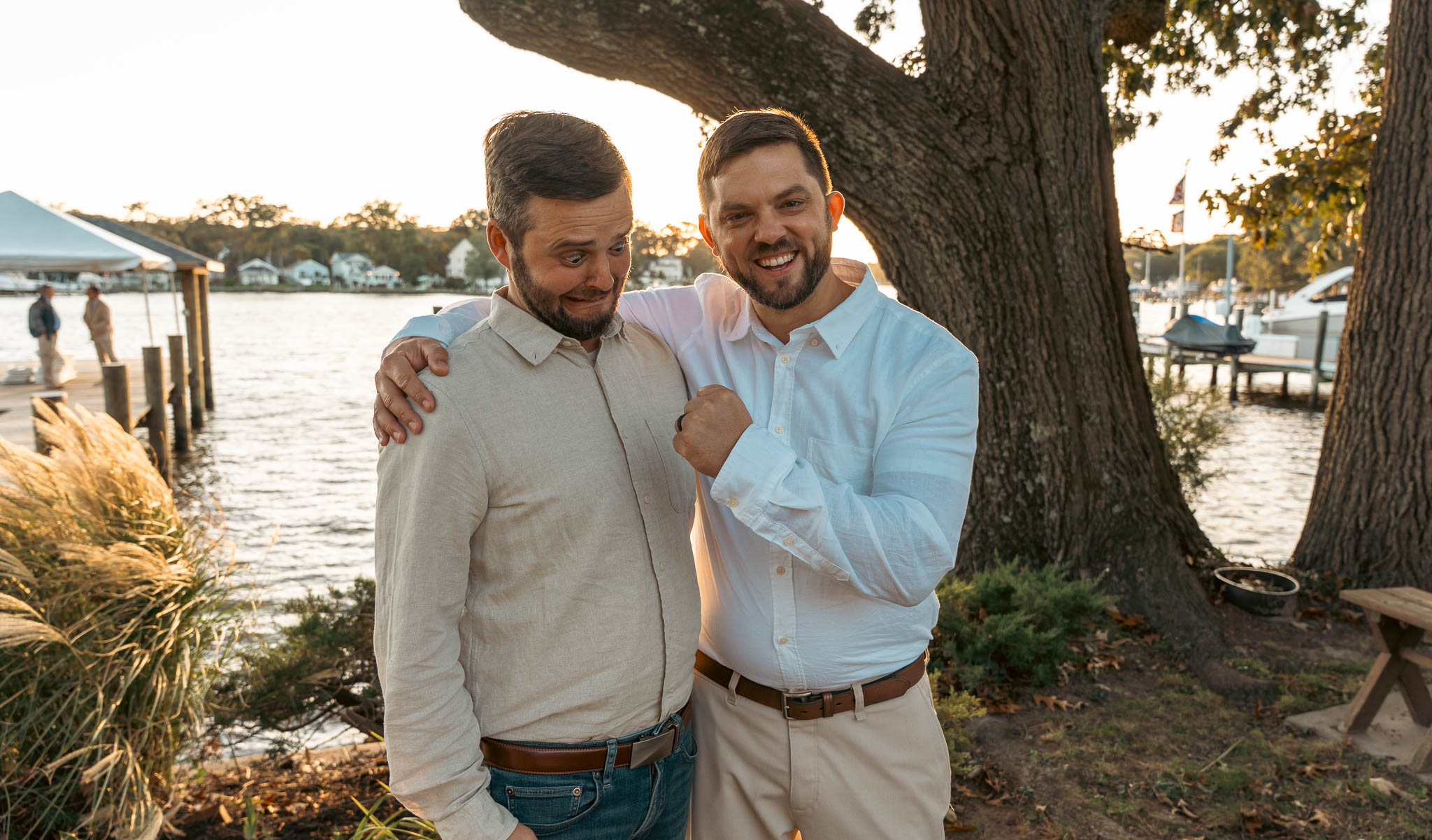 Guests in the backyard by the water after the ceremony — backyard wedding in Annapolis, Maryland