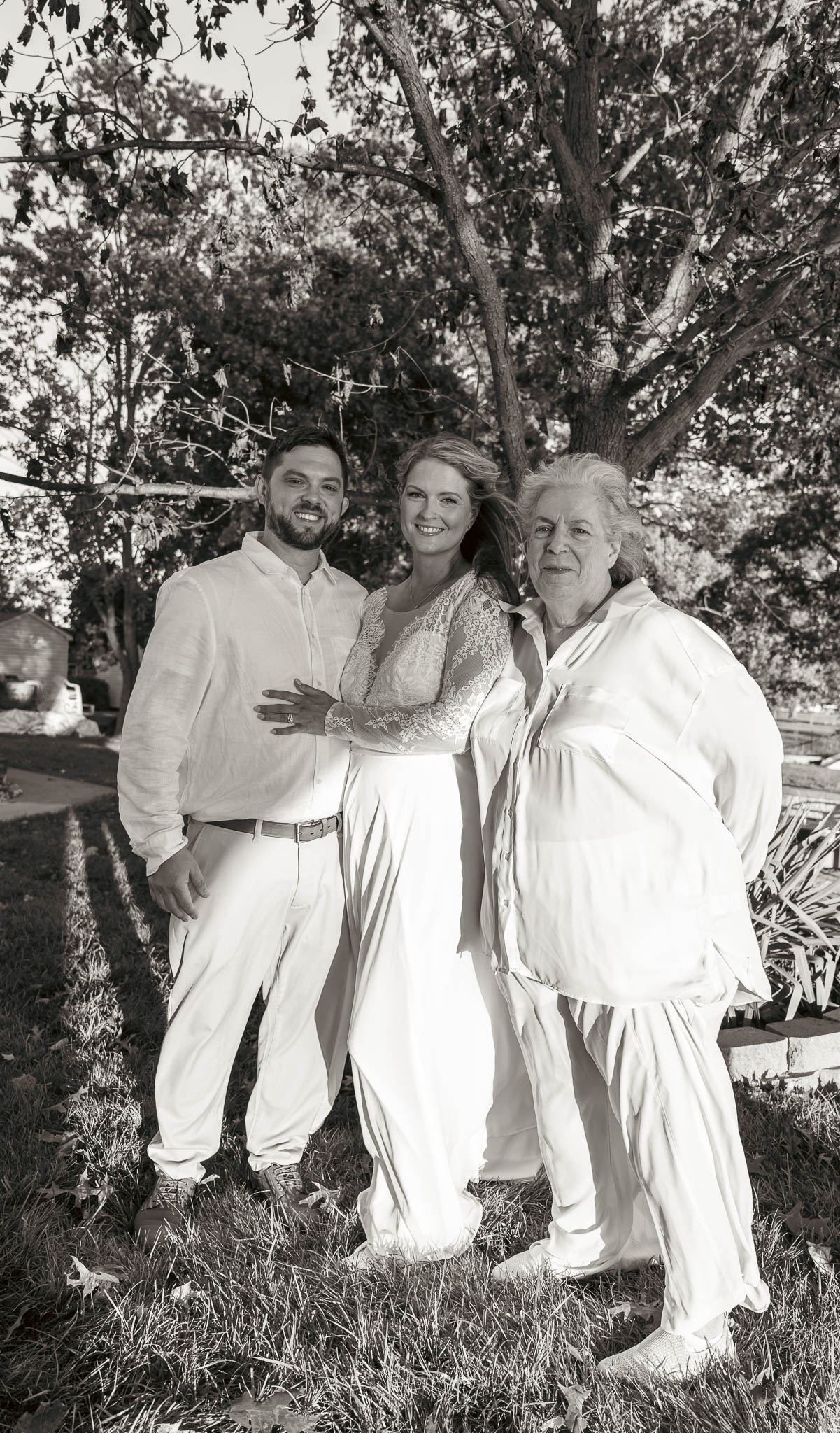 Couple portrait under the oak in the last of the light — backyard wedding in Annapolis, Maryland