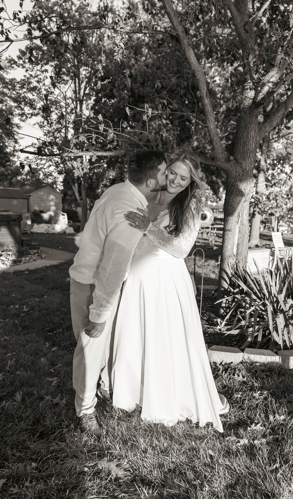 The couple in the evening light beside the water — backyard wedding in Annapolis, Maryland