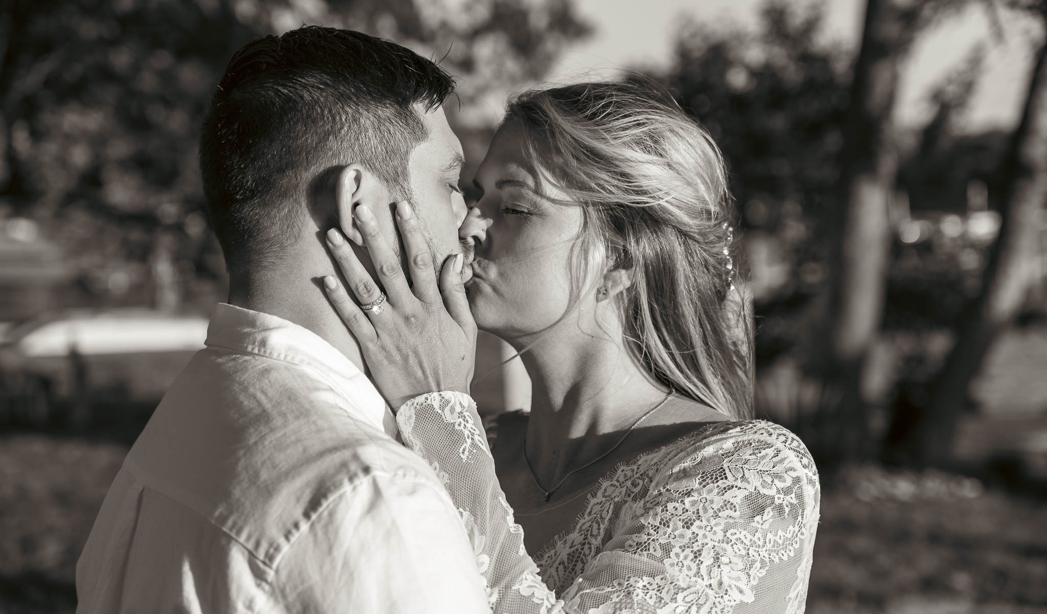 Warm evening portrait of the newlyweds by the creek — backyard wedding in Annapolis, Maryland
