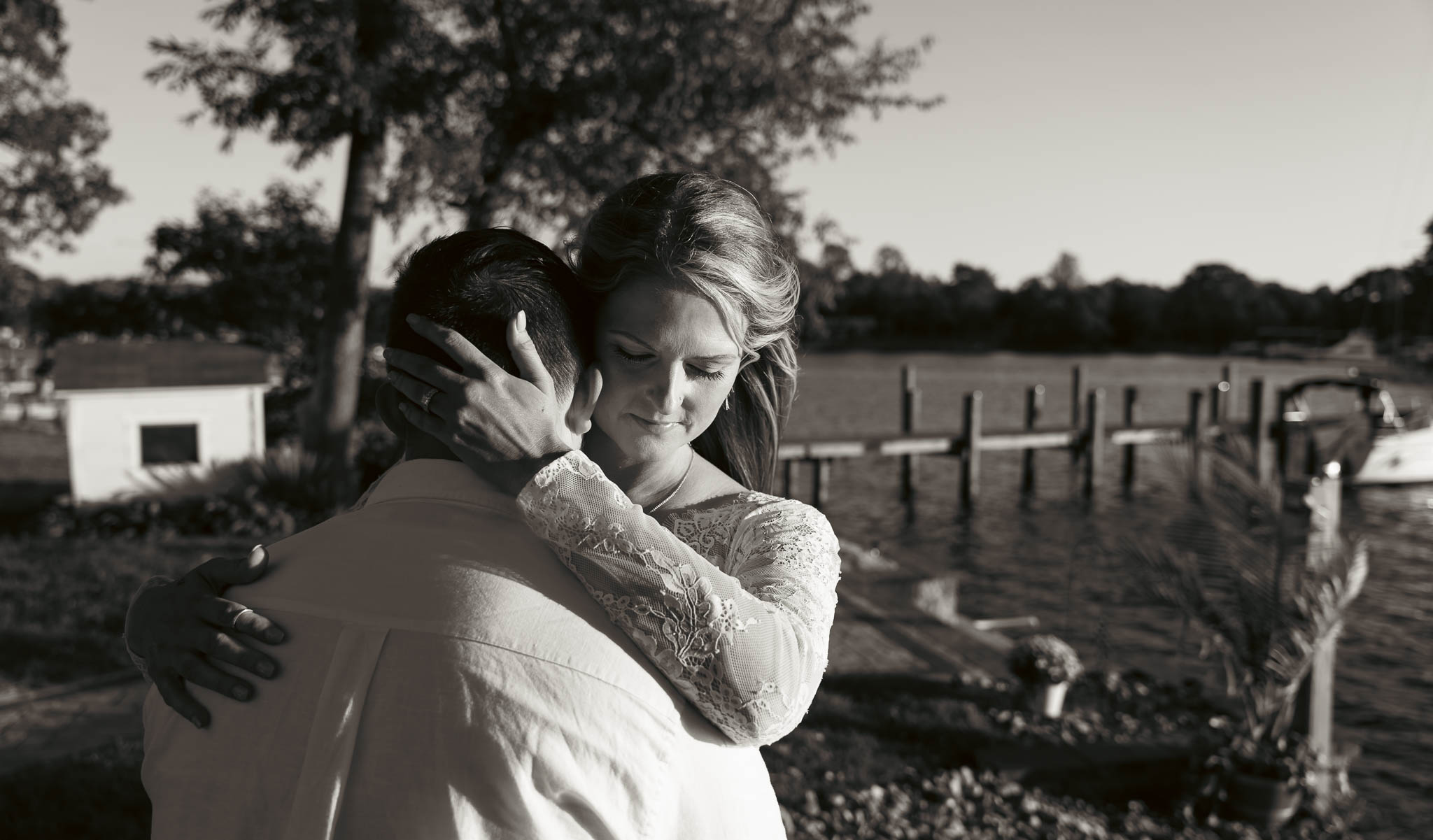 The couple in the evening light beside the water — backyard wedding in Annapolis, Maryland