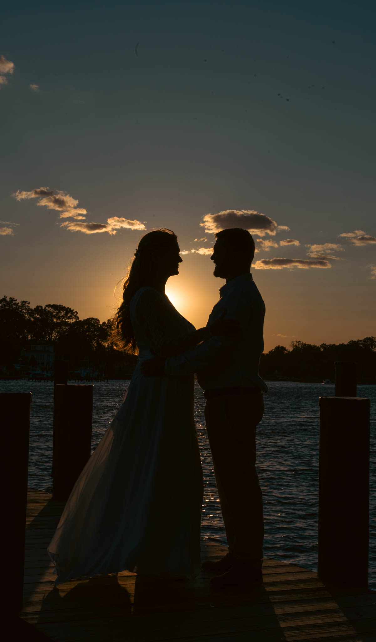 Sunset silhouette on the dock at the end of the day — backyard wedding in Annapolis, Maryland