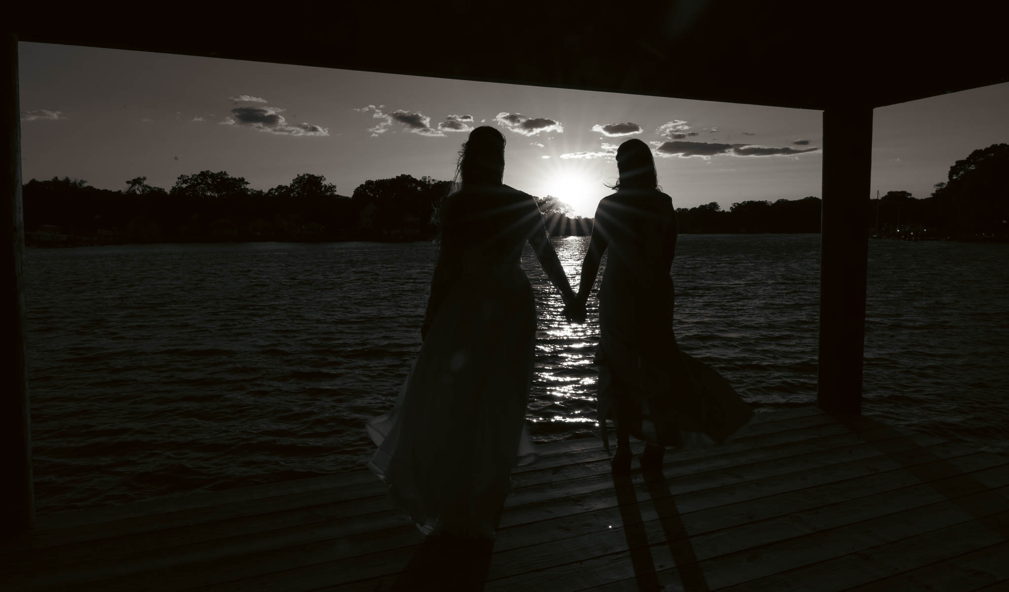 Sunset silhouette on the dock at the end of the day — backyard wedding in Annapolis, Maryland