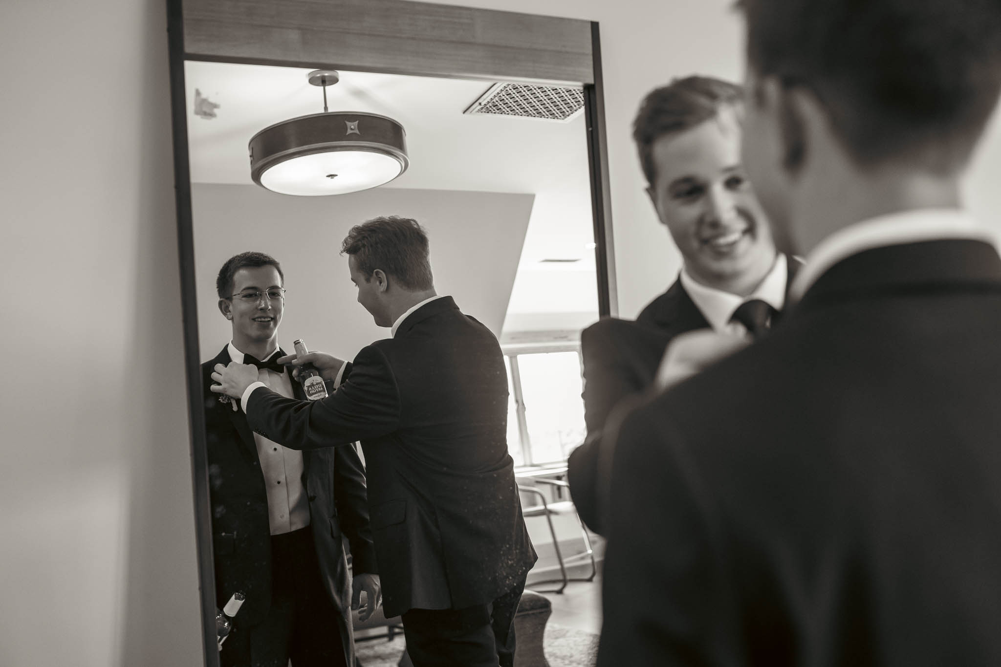 Groom and his groomsmen in the doorway before the ceremony — black and white — Sylvanside Farm wedding in Purcellville, Virginia