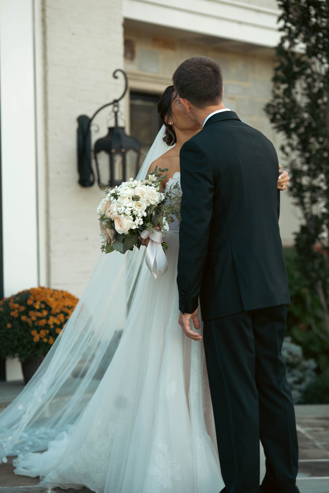 First look on the lawn outside the manor house — Sylvanside Farm wedding in Purcellville, Virginia
