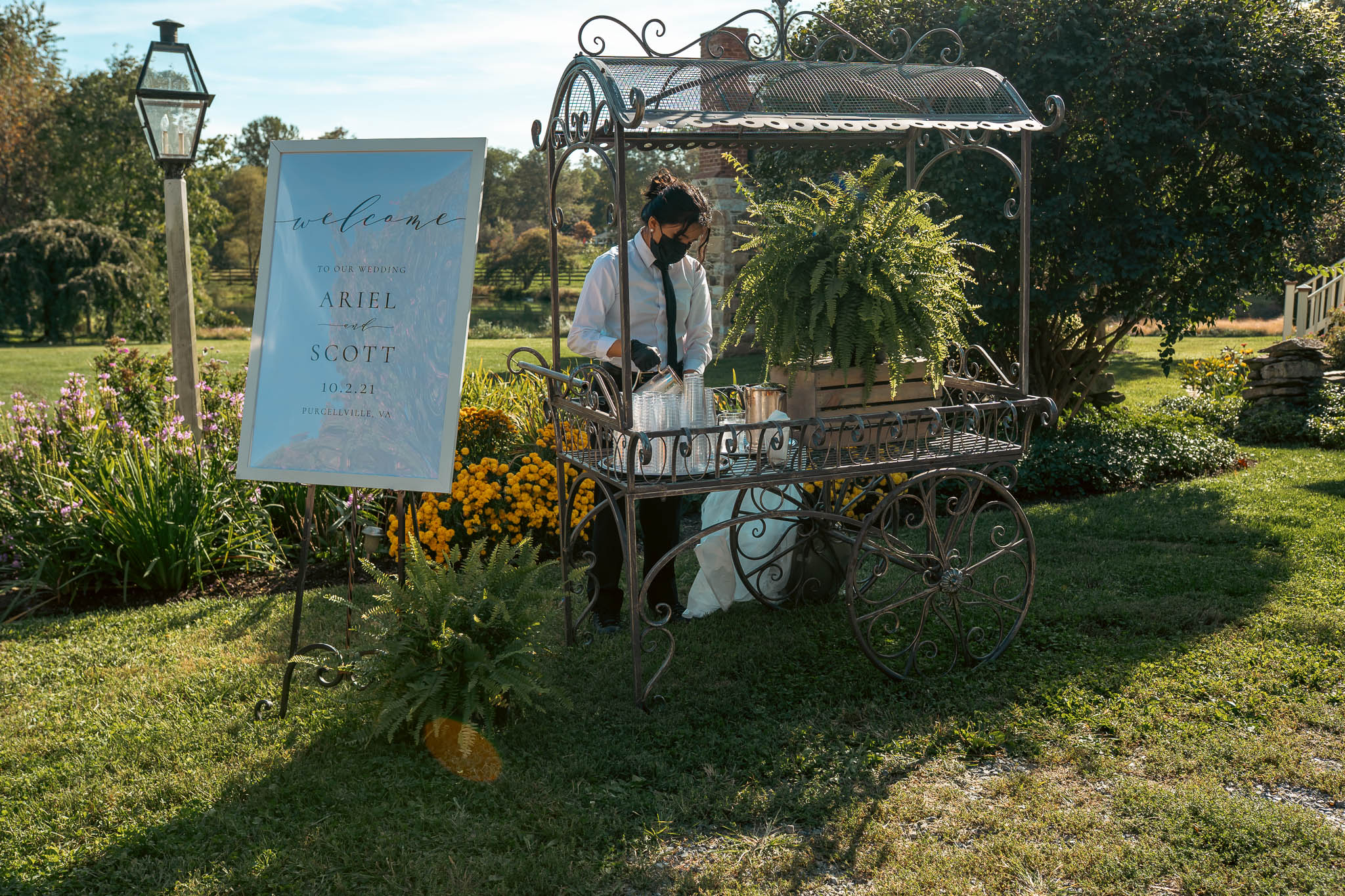 Welcome sign and autumn flower cart at the farm entrance — Sylvanside Farm wedding in Purcellville, Virginia