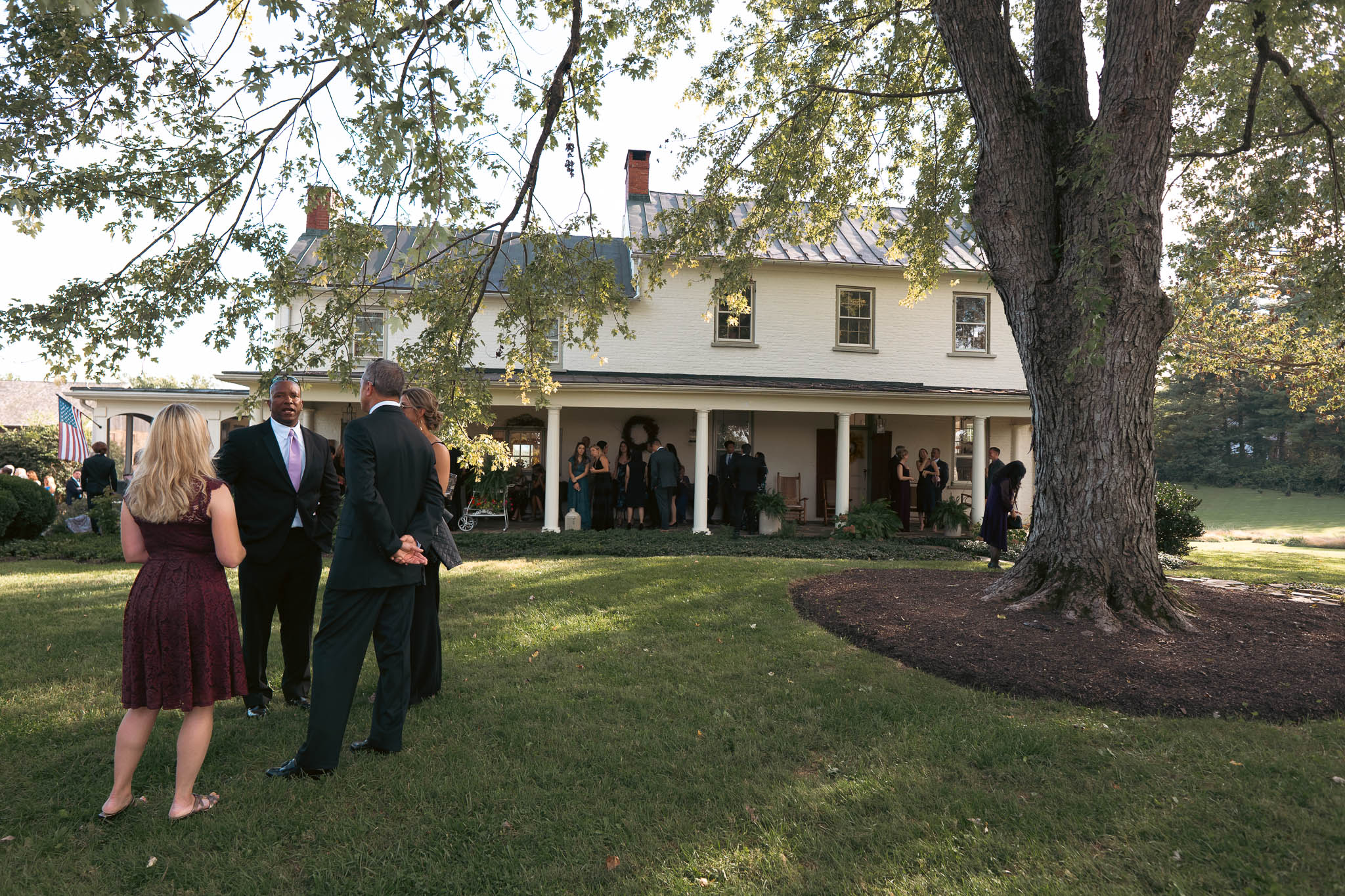Guests arriving on the lawn before the ceremony — Sylvanside Farm wedding in Purcellville, Virginia