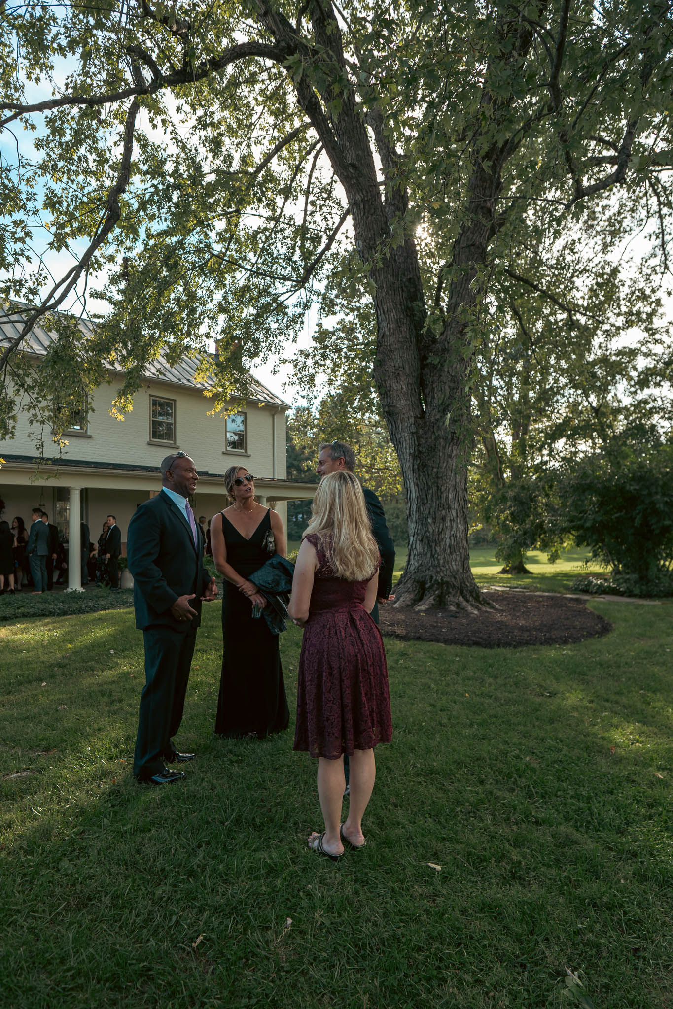 Wedding guests walking the farm lane to the ceremony — Sylvanside Farm wedding in Purcellville, Virginia
