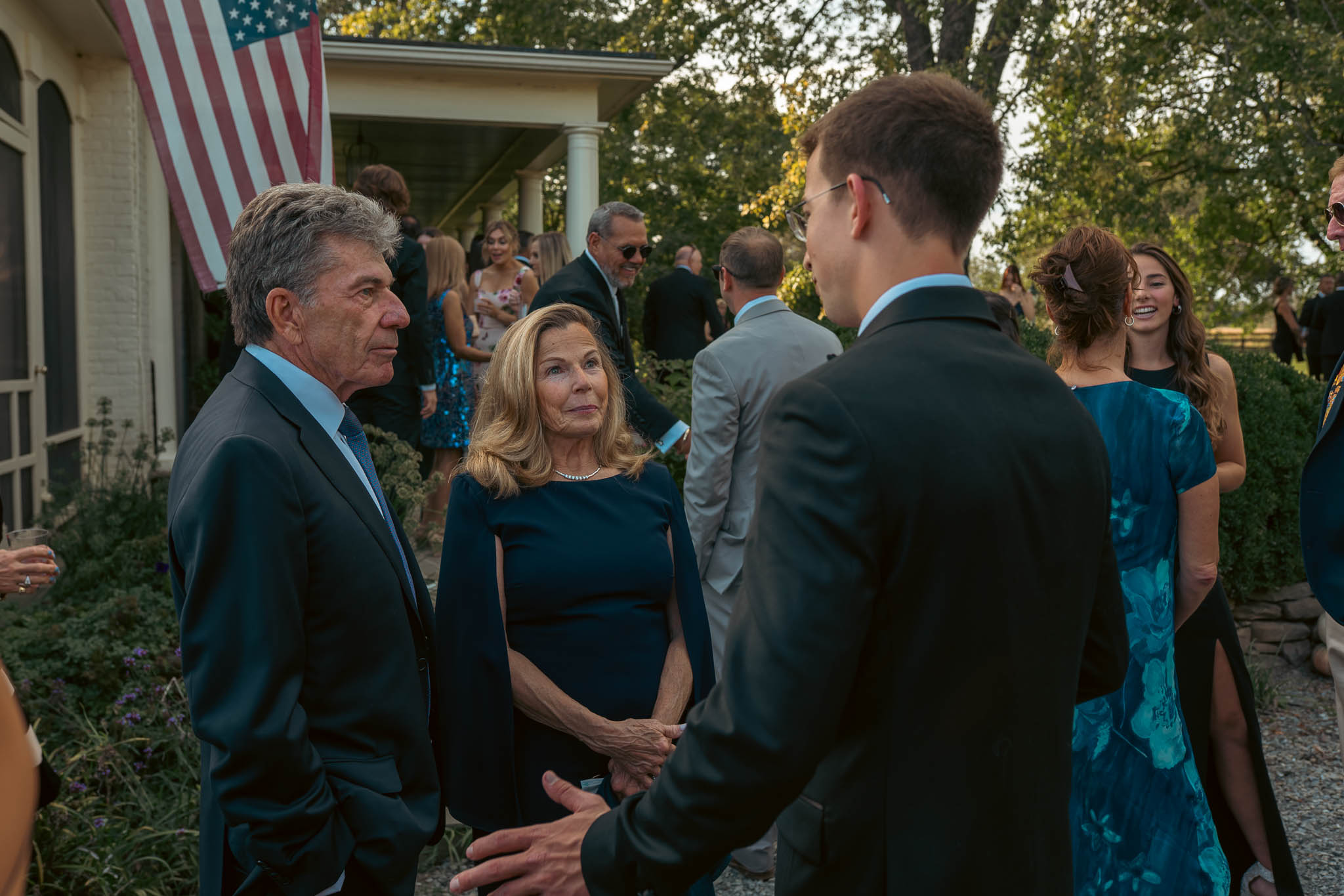 Wedding guests greeting each other before the ceremony — Sylvanside Farm wedding in Purcellville, Virginia