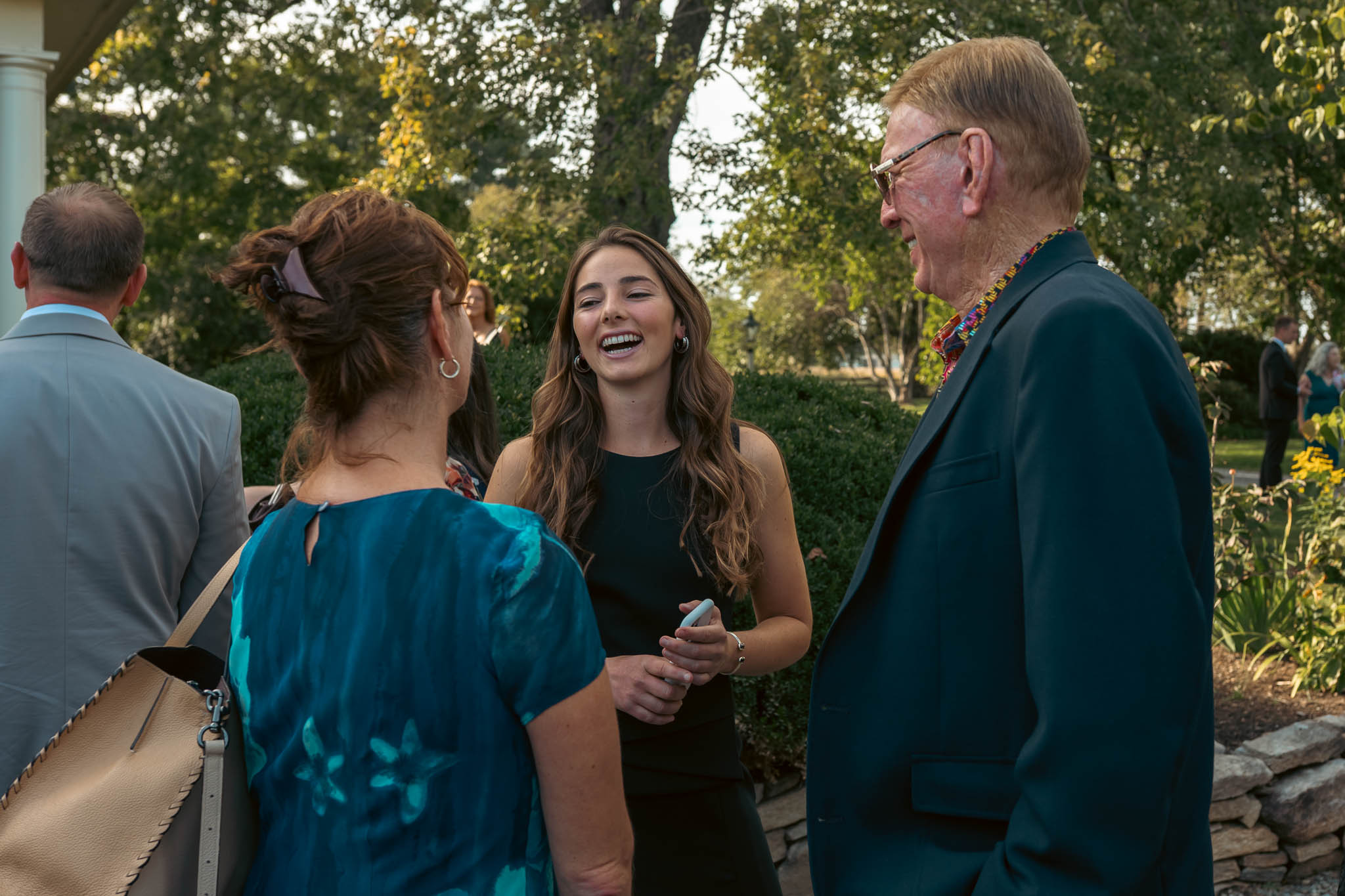Guests crossing the farm lane on an October afternoon — Sylvanside Farm wedding in Purcellville, Virginia
