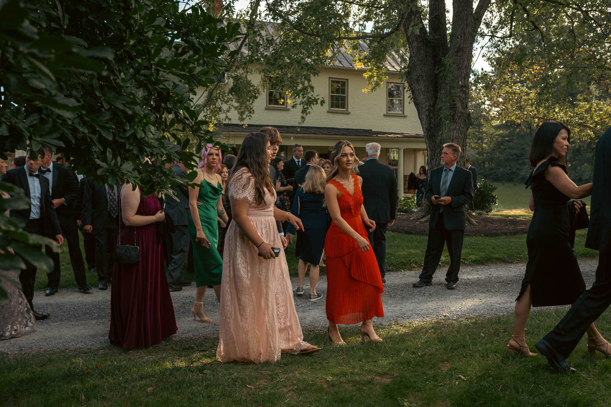 Wedding guests walking the farm lane to the ceremony — Sylvanside Farm wedding in Purcellville, Virginia