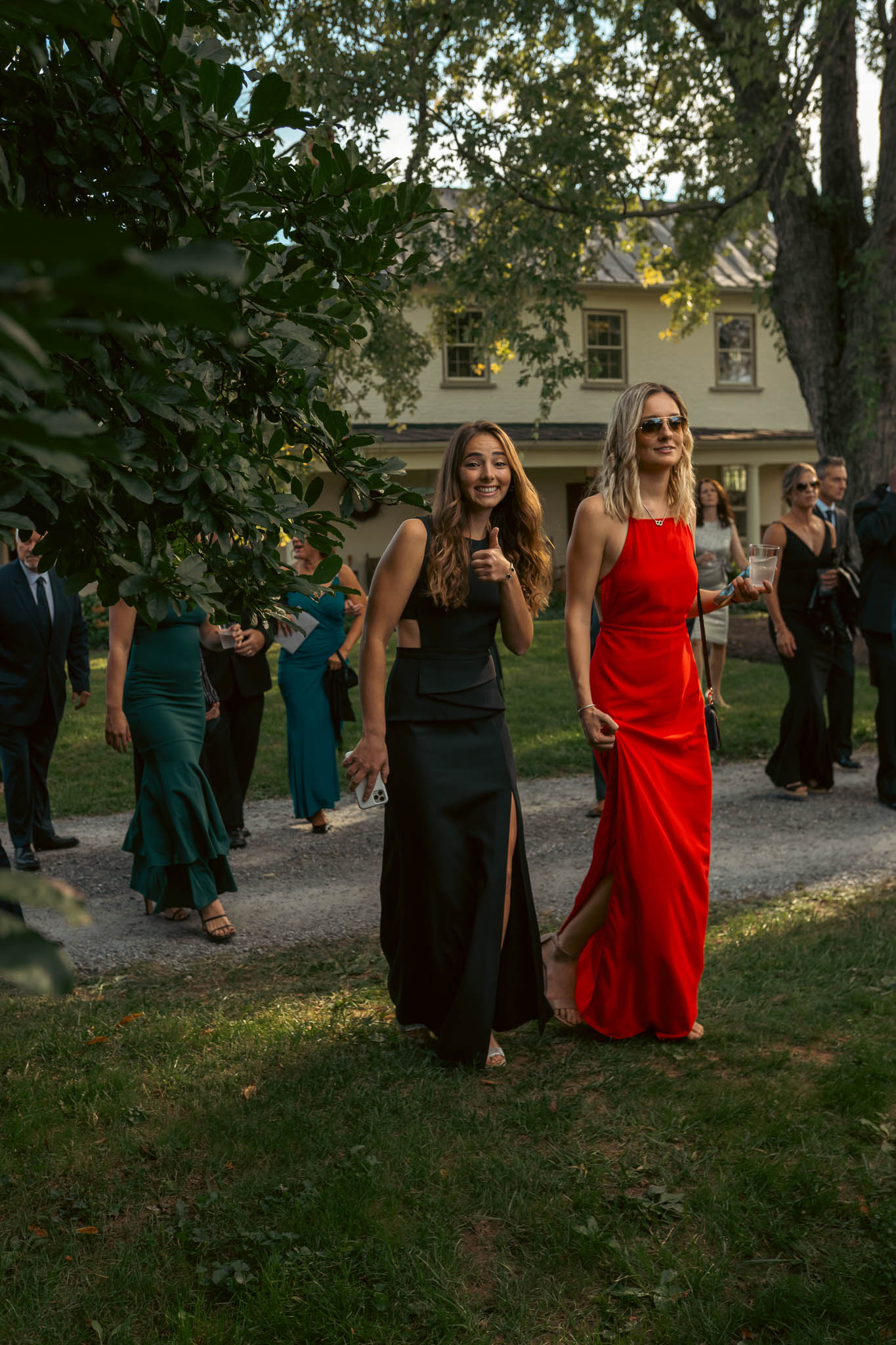 Wedding guests walking the farm lane to the ceremony — Sylvanside Farm wedding in Purcellville, Virginia