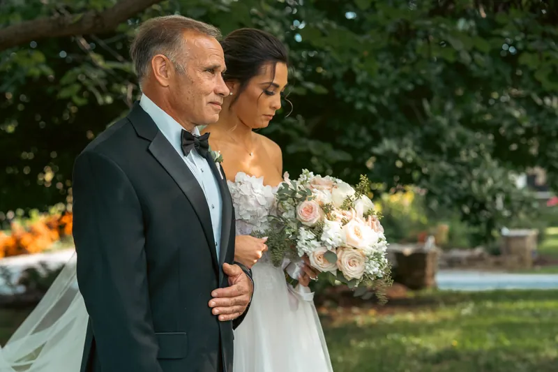 A bride on her father's arm moments before the aisle — Sylvanside Farm